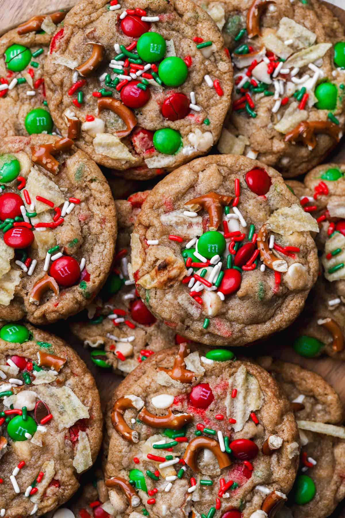 Kitchen sink Christmas cookies with m&m's, white chocolate, pretzels, potato chips and sprinkles.