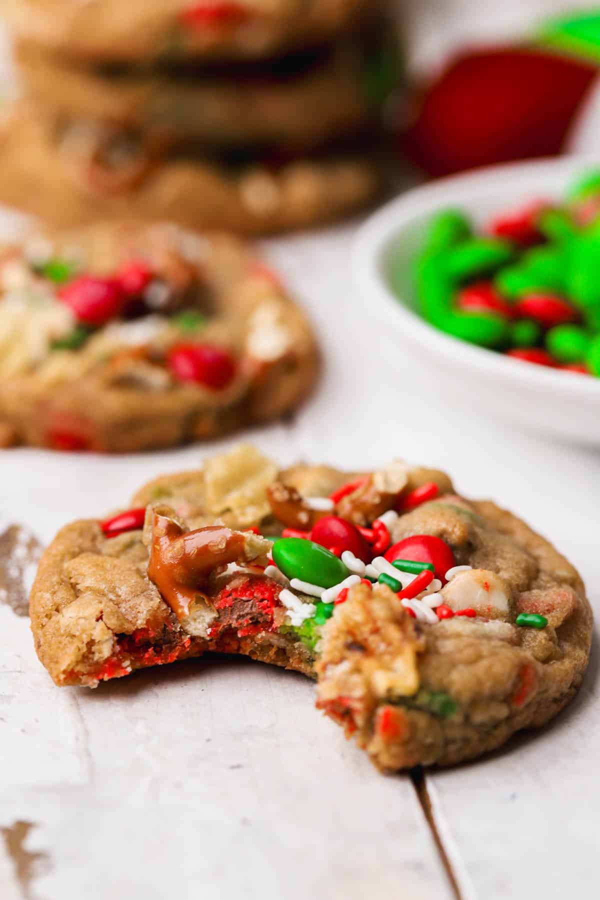 Kitchen sink cookies topped with M&M's sprinkles, pretzels, white chocolate and potato chips. 