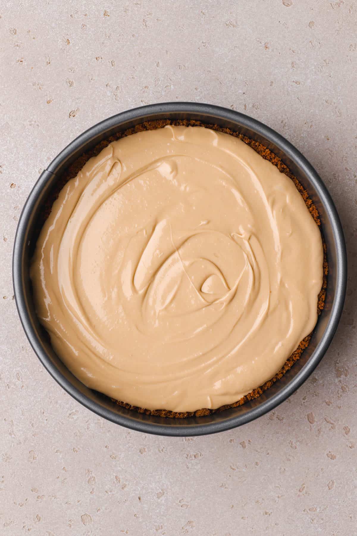 Cheesecake batter inside baked crust.