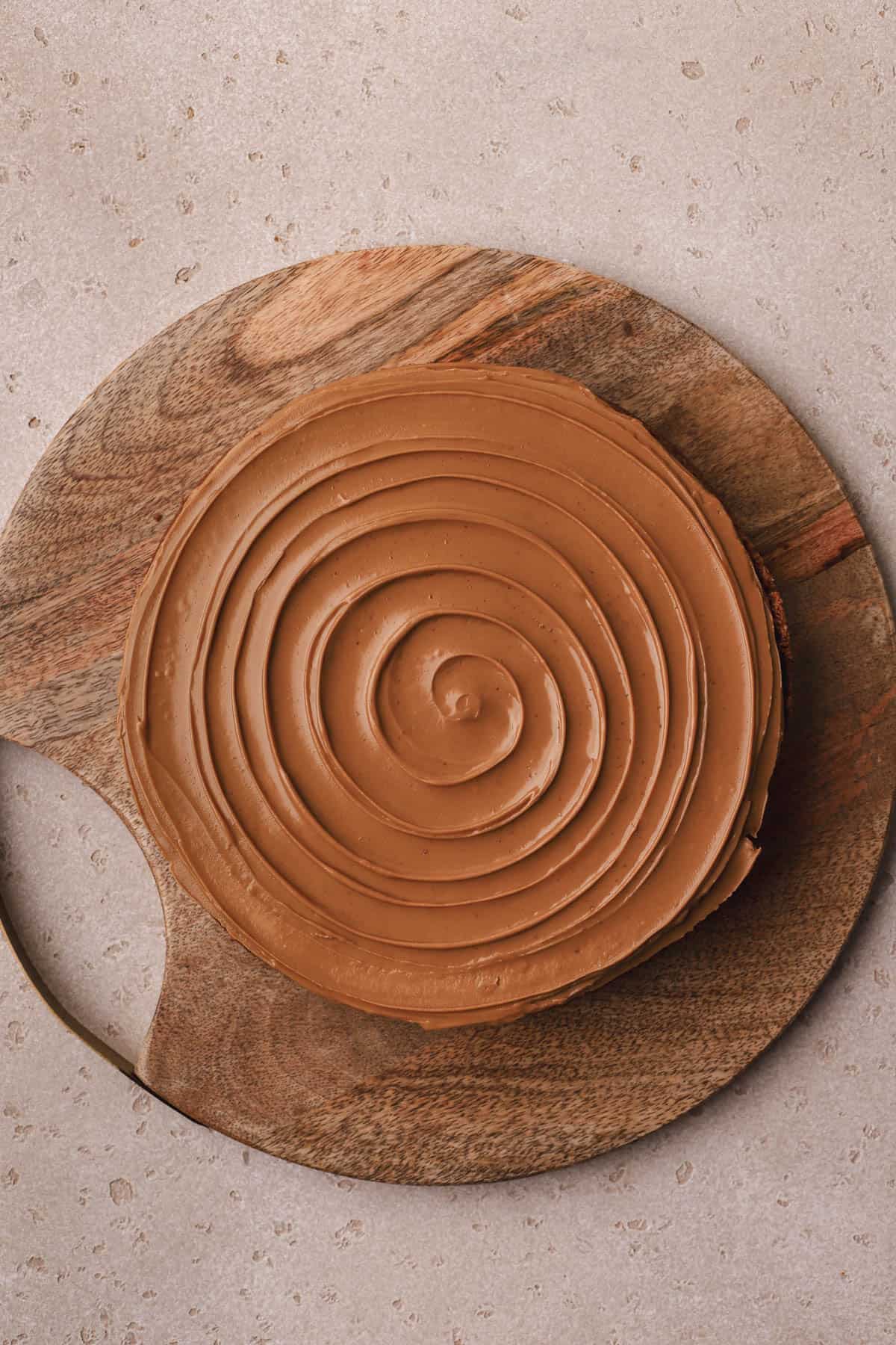 Biscoff cheesecake with swirls of melted cookie butter on top.