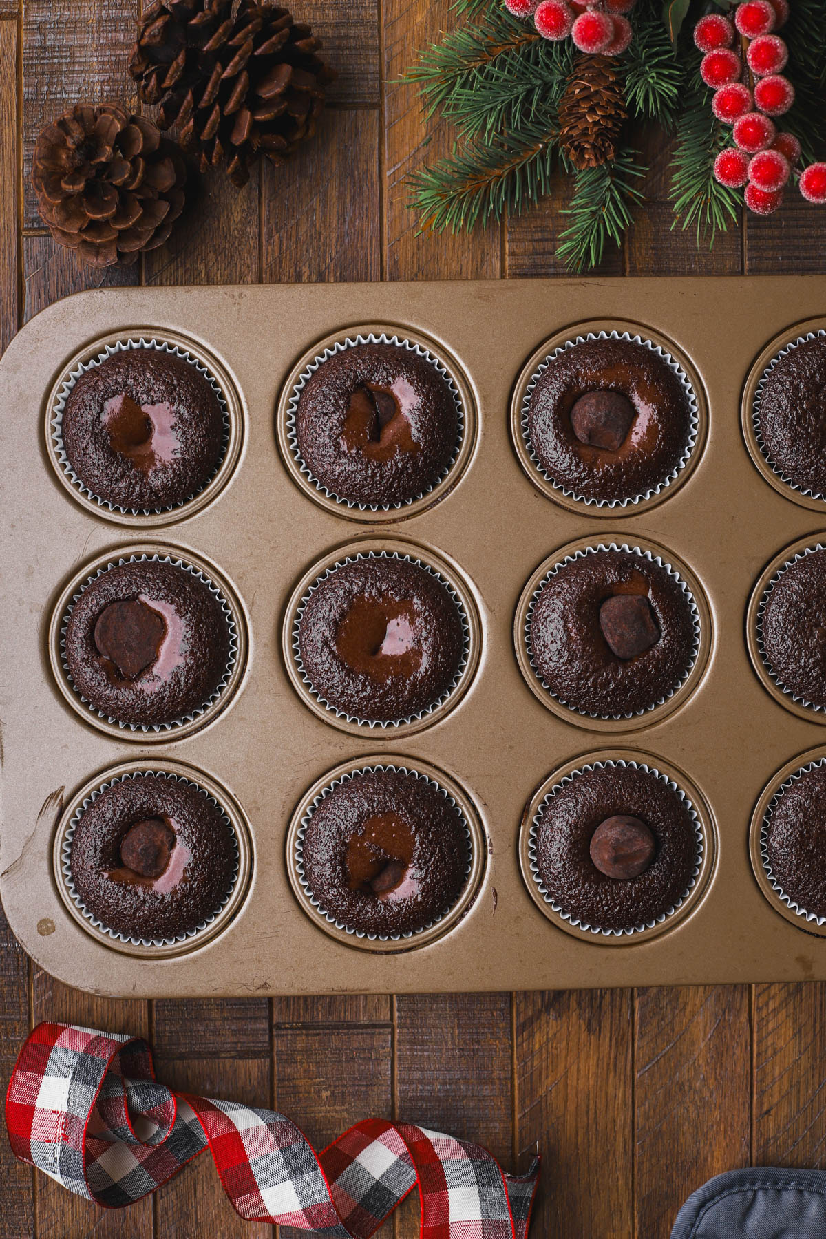 Par-baked cupcakes with chocolate truffles inside.  