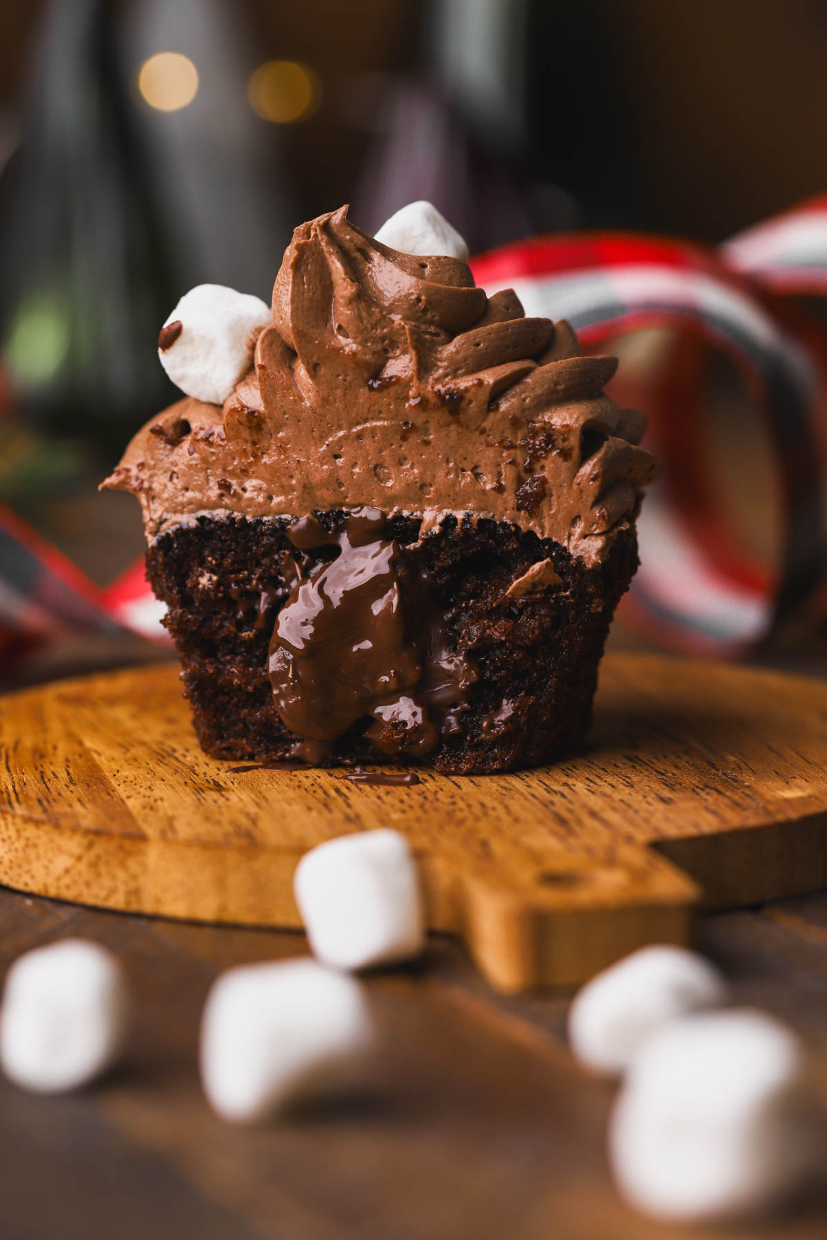 Hot cocoa cupcakes with melted chocolate truffle in the center.  