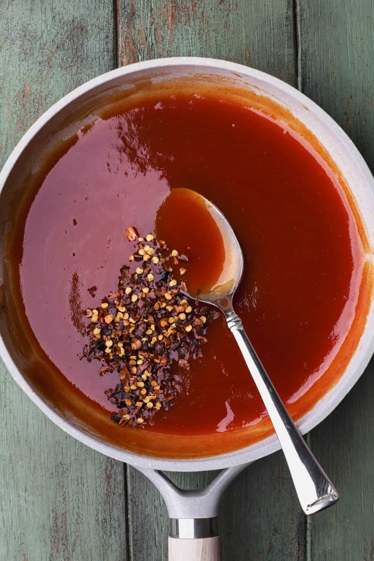 Sweet and sour sauce with red chili flakes. 