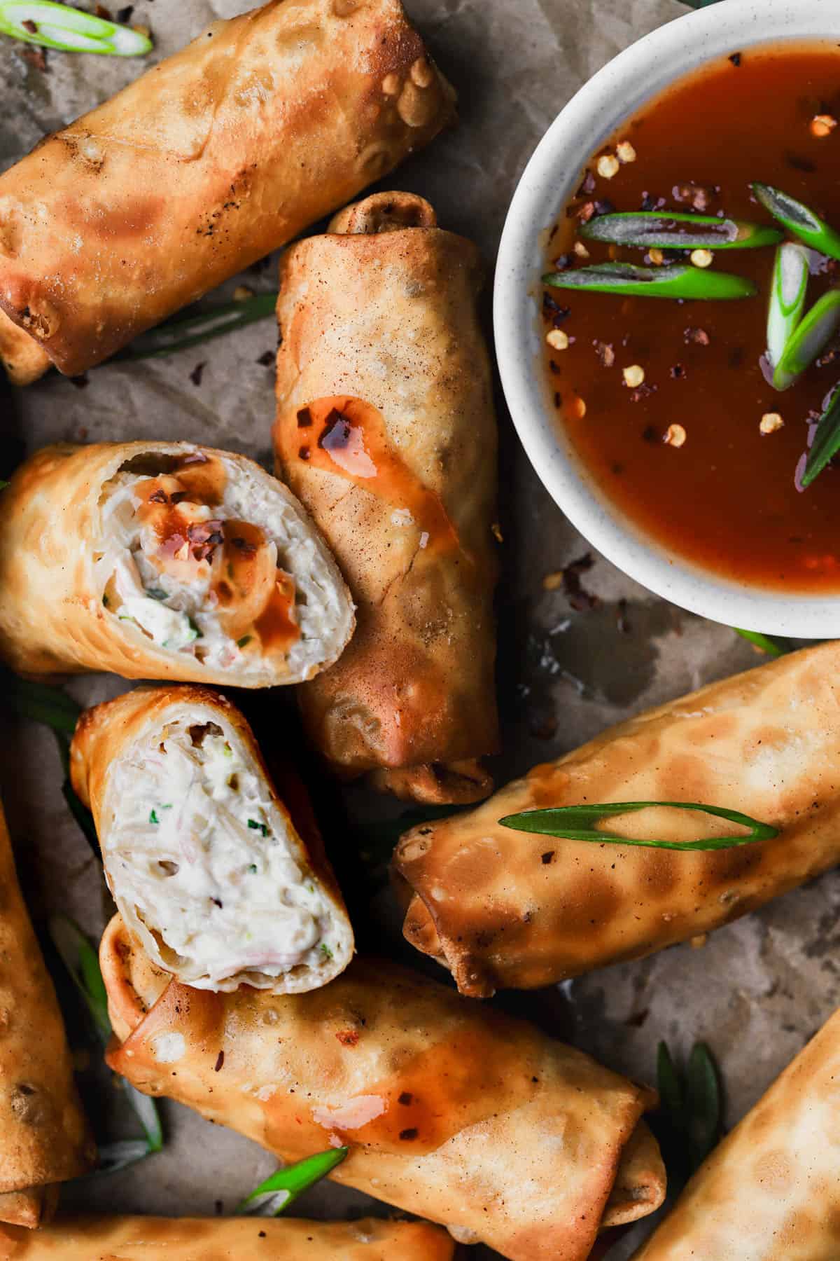 Crab Rangoon Egg Rolls with homemade sweet and sour dipping sauce. 
