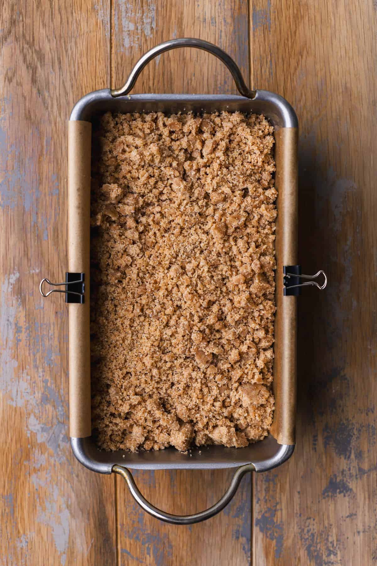 Streusel topping over banana bread batter. 