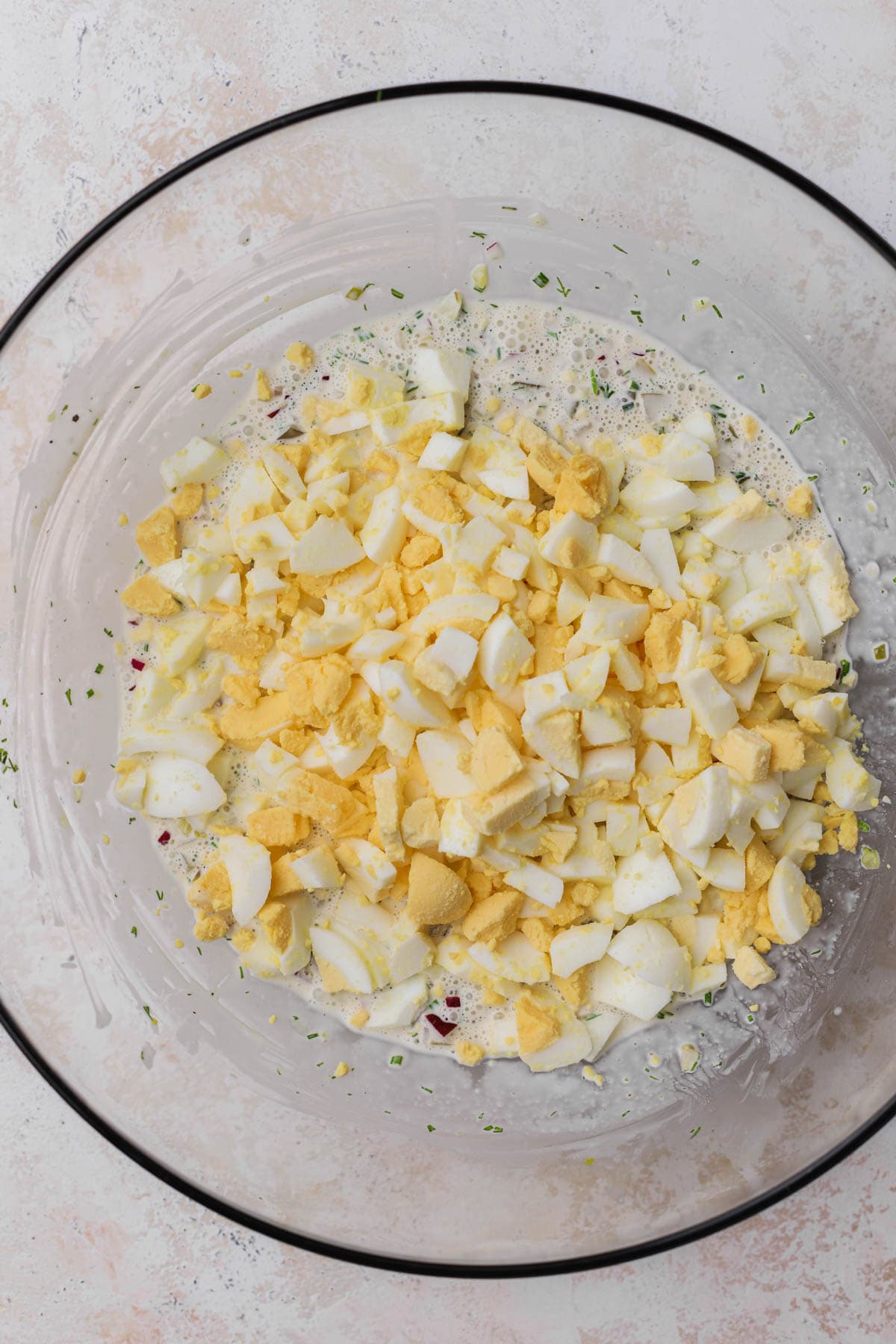 Chopped boiled eggs with mayo, dijon, herbs, onions, pickles, celery seed.