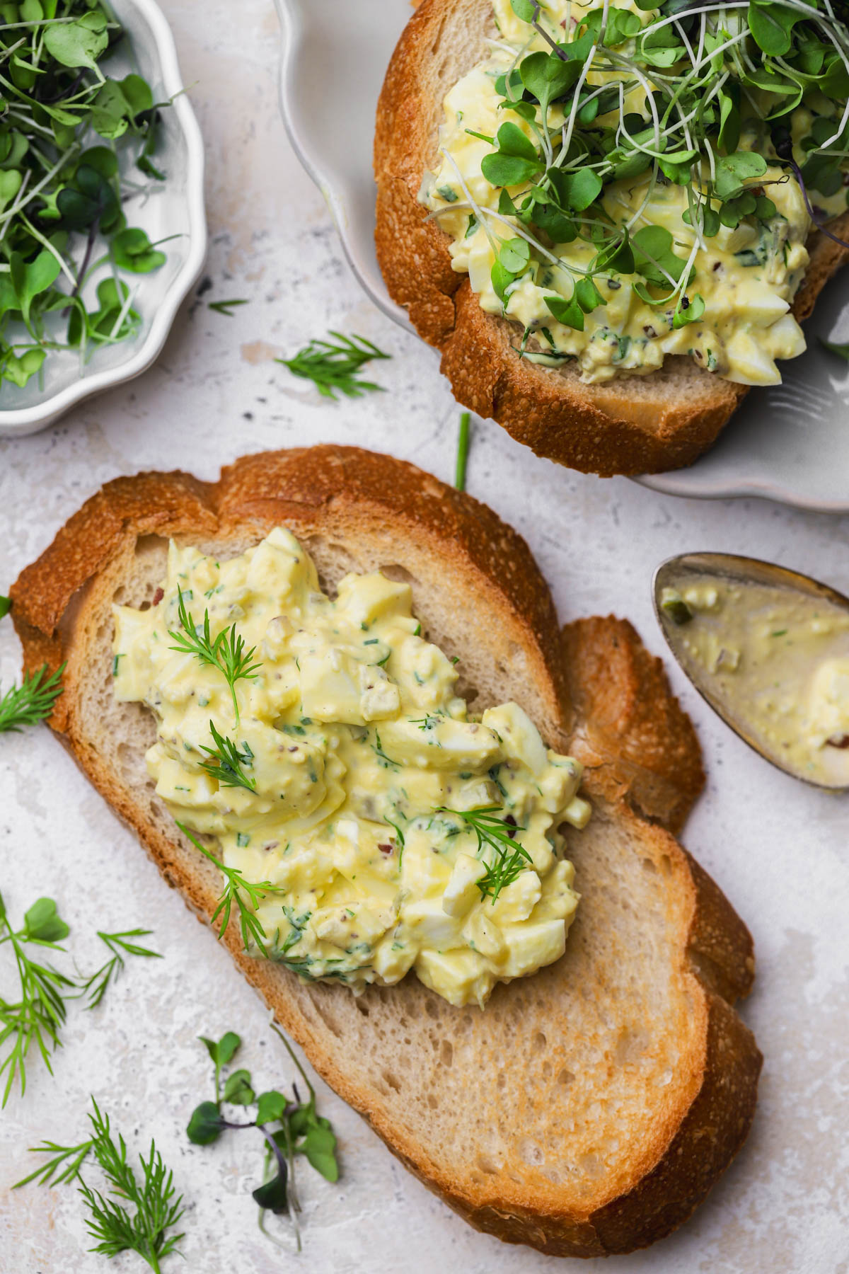 Egg salad with fresh herbs, dill pickles, dijon and mayo.  