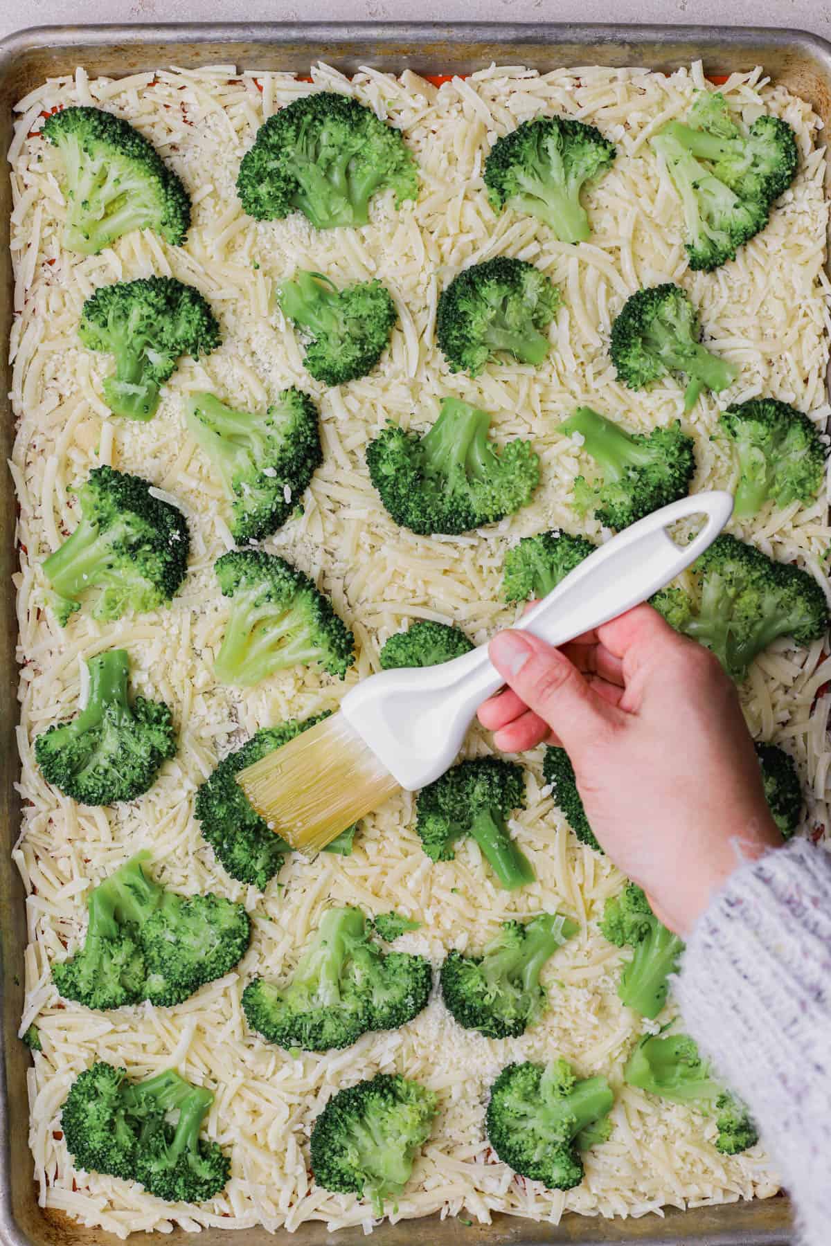 Shredded parmesan cheese, garlic oil, broccoli. 