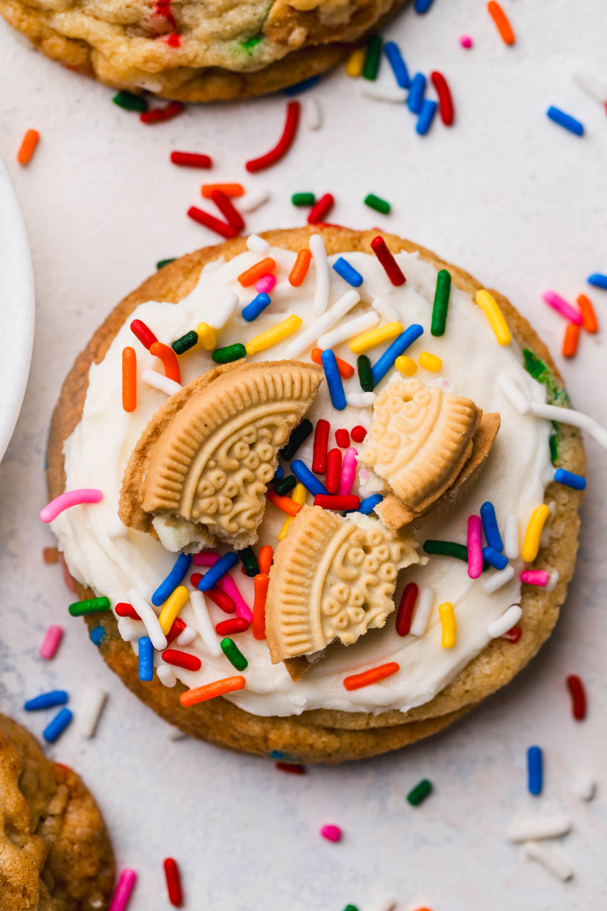 Funfetti cookie with chopped cookies and sprinkles with buttercream frosting. 