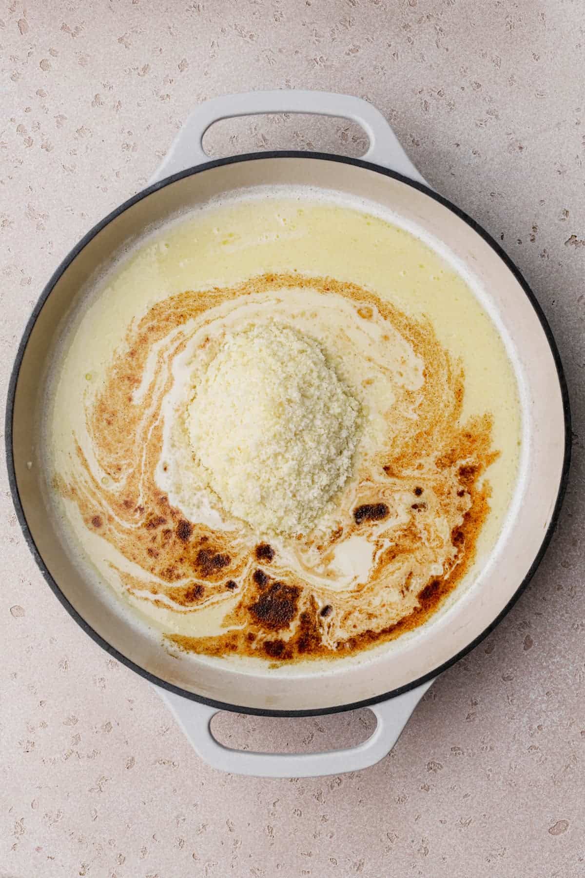 Butter, garlic, white wine, cajun spices, parmesan cheese and heavy cream. 