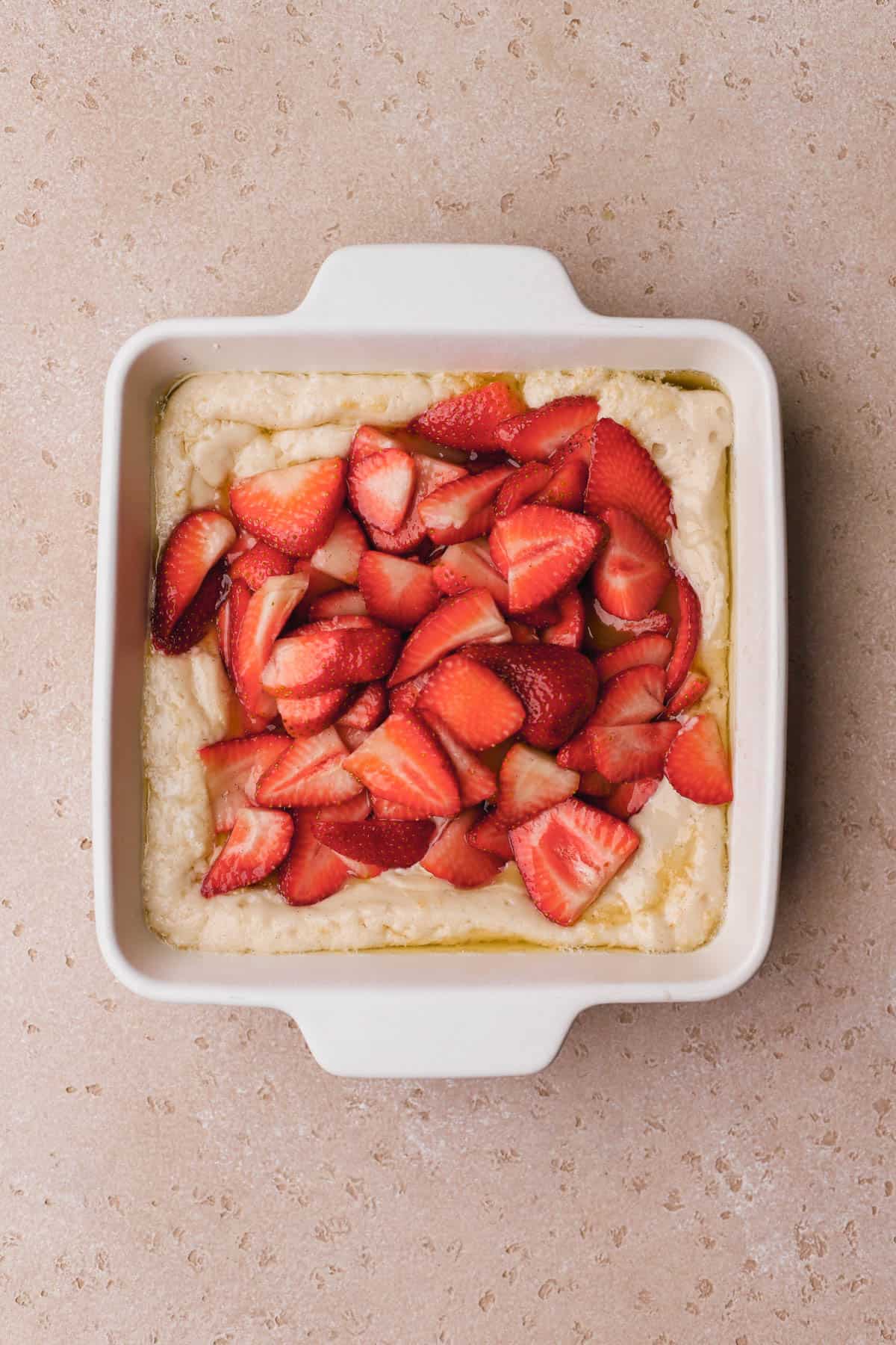 Vanilla cake batter, melted butter and macerated strawberries.  
