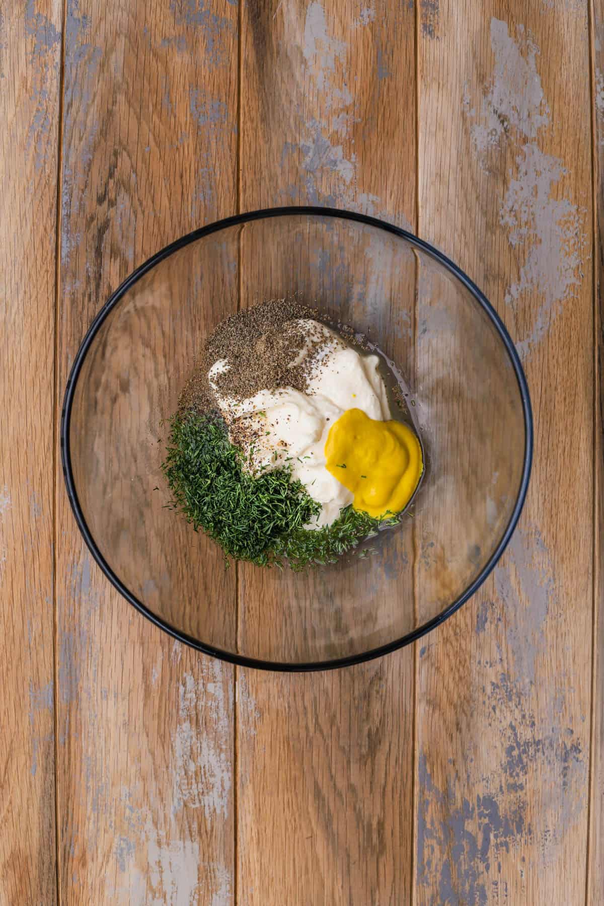 Mayo, dill, apple cider vinegar, mustard, pickle juice, salt and pepper. 