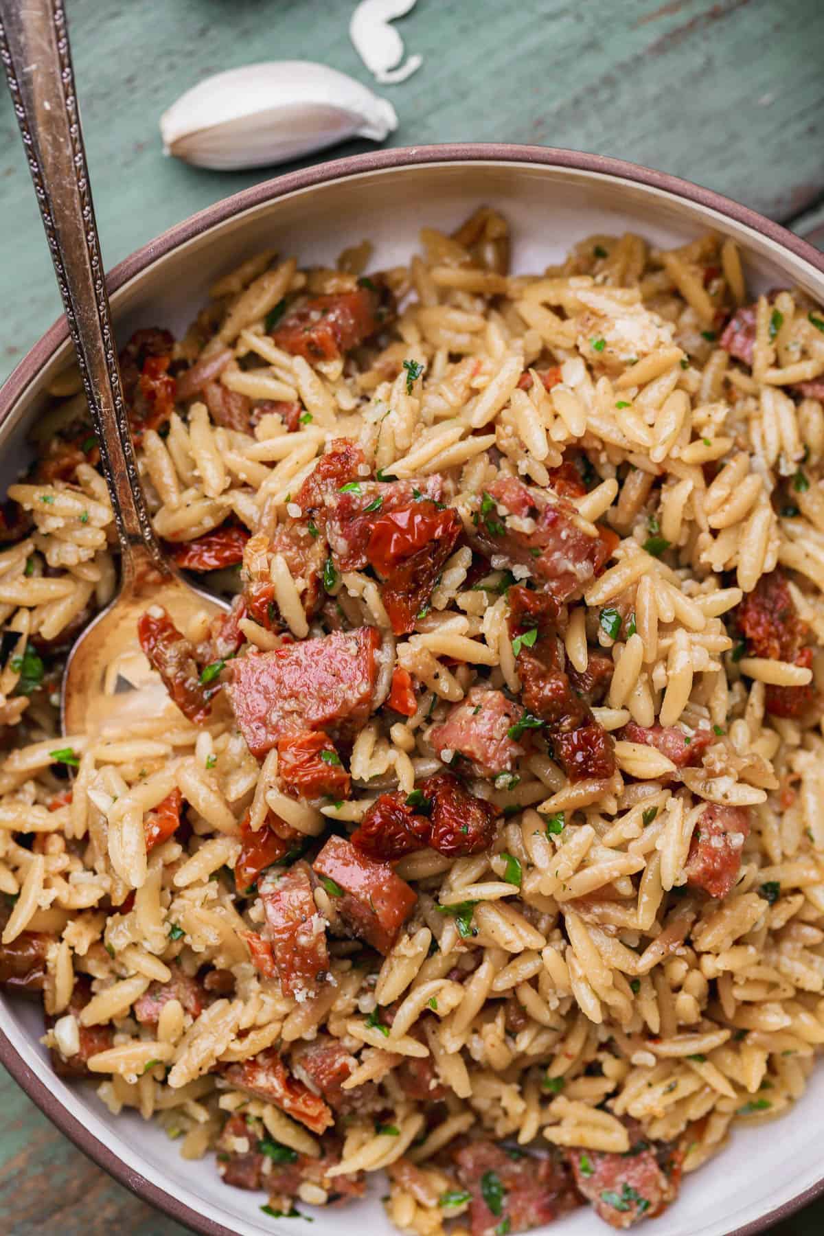 Chorizo orzo with sun-dried tomatoes, parmesan and fresh parsley.