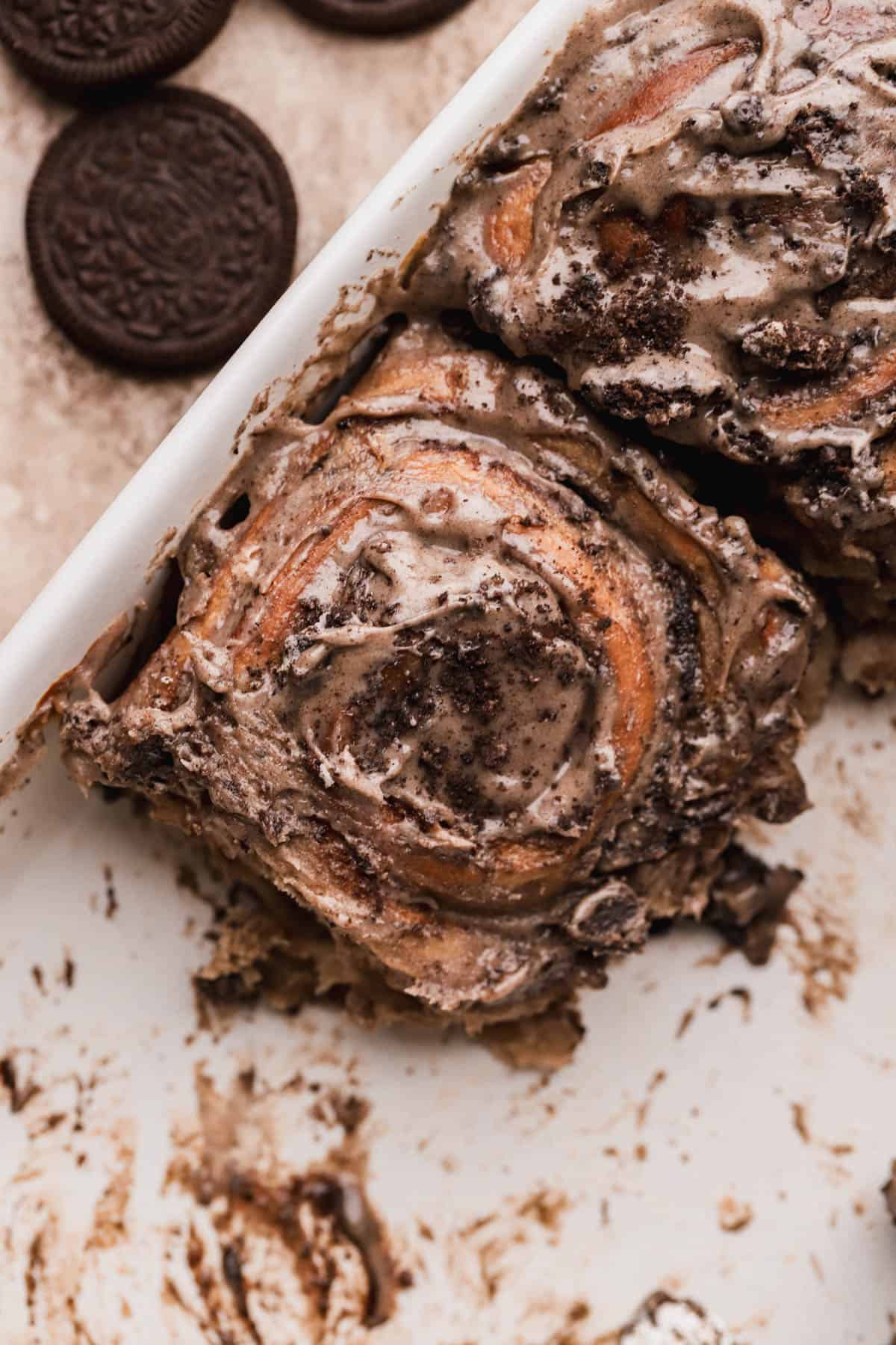 Baked cinnamon rolls with crushed oreo cookies.