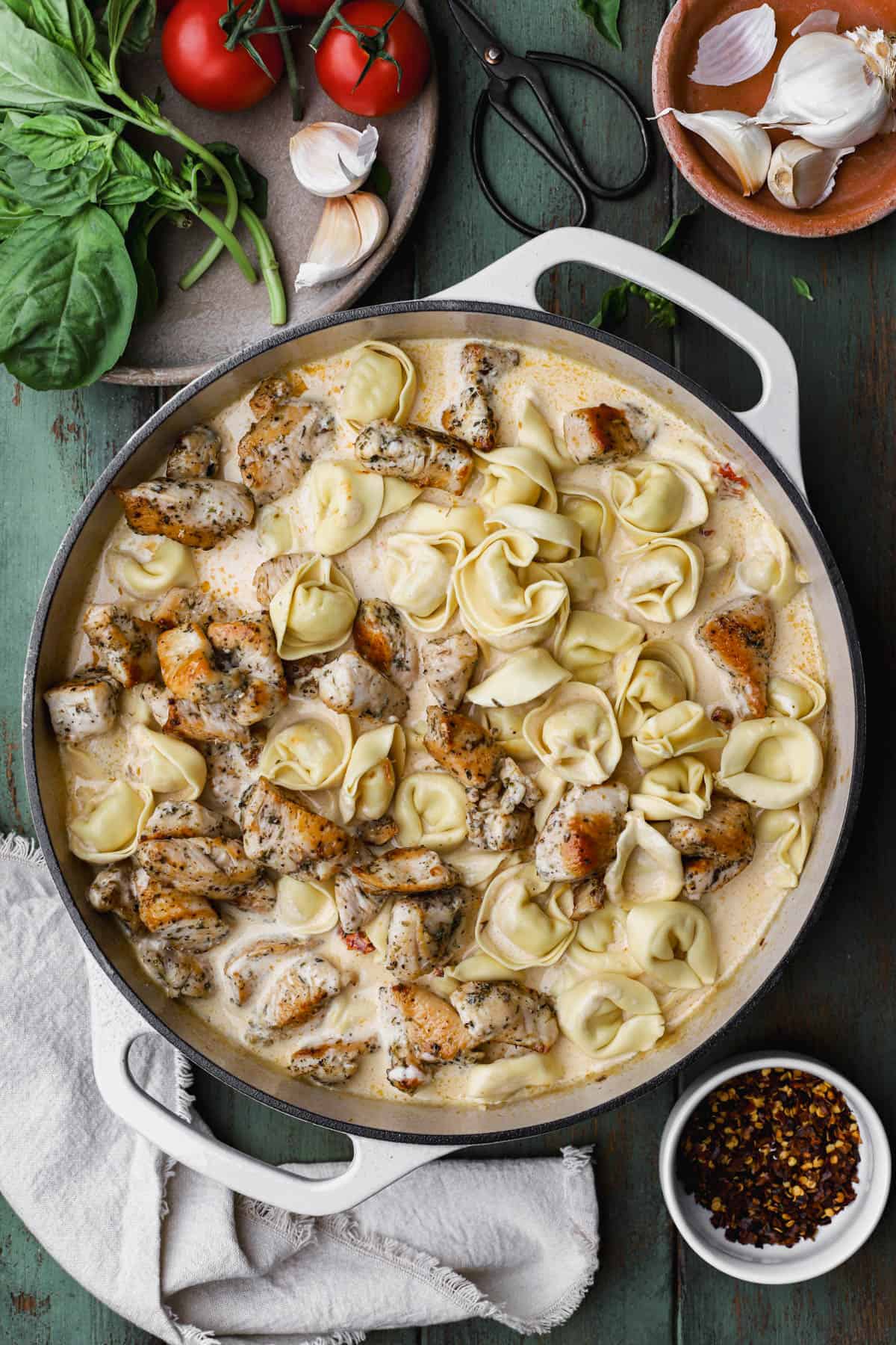 Seared chicken with aromatics, chicken stock, cream, sun-dried tomatoes and heavy cream. 