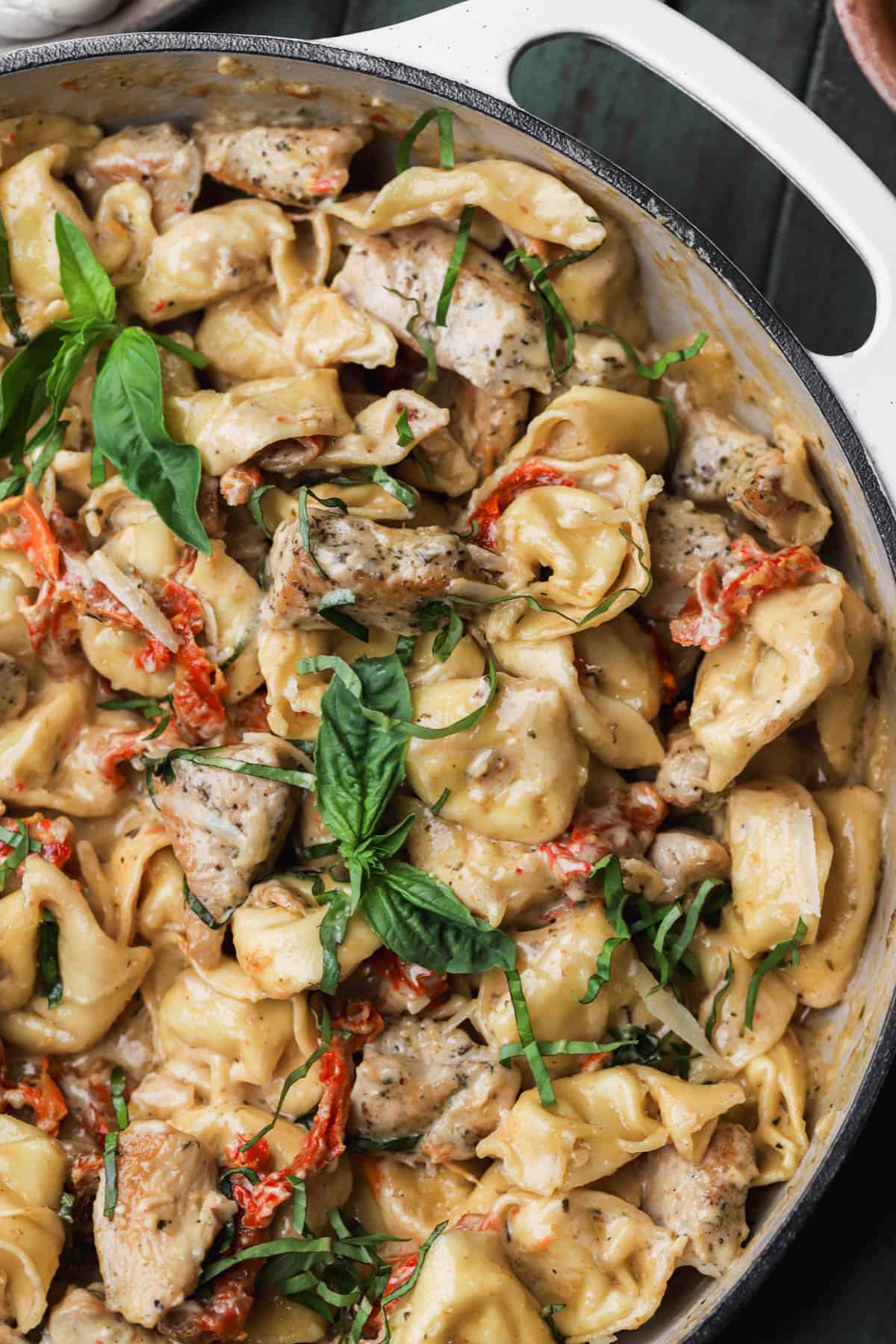 Marry me chicken tortellini with seasoned chicken, sun-dried tomatoes, parmesan and fresh basil.  