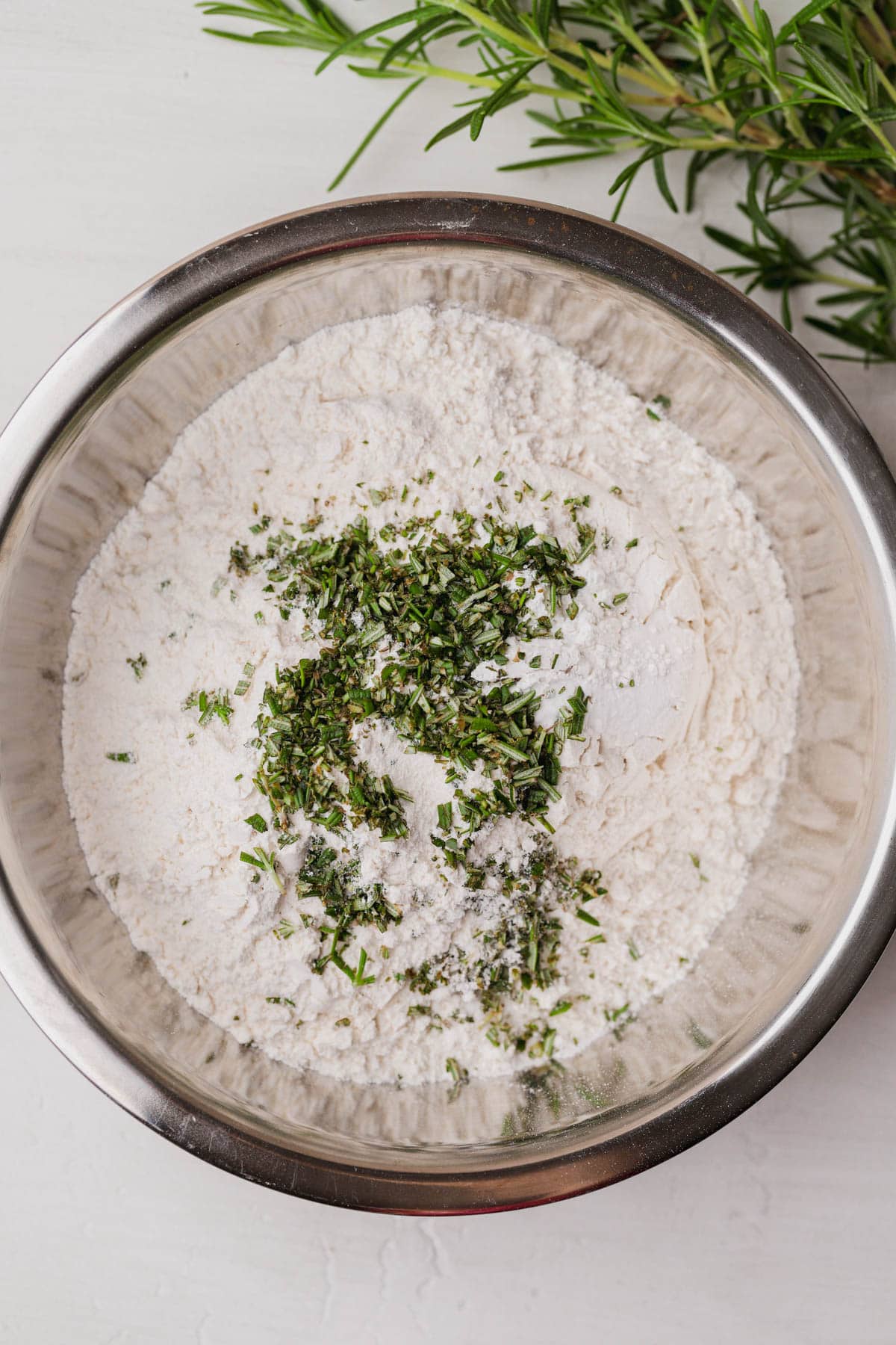 Flour, baking soda, baking powder, chopped rosemary and salt. 