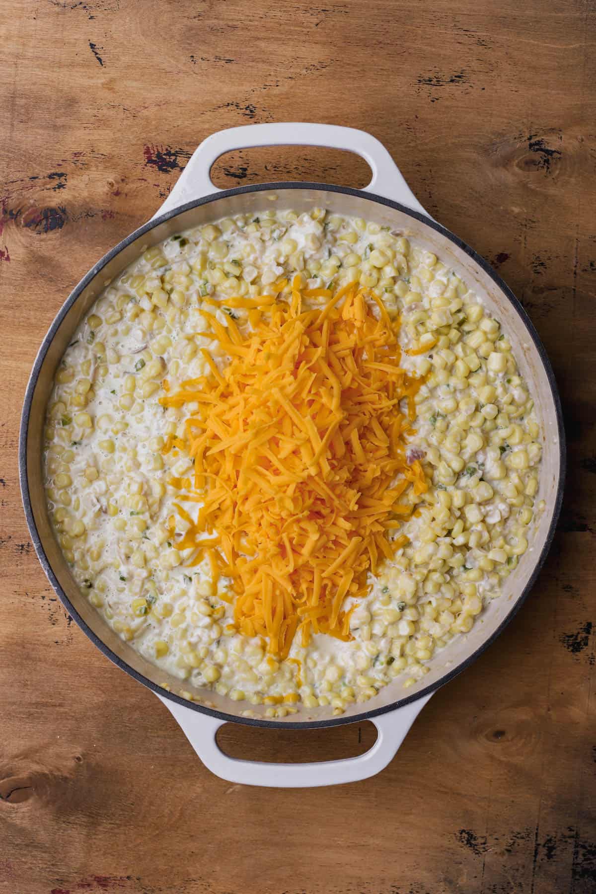 Butter, jalape&ntilde;os, red onions, garlic, corn, heavy cream, cream cheese and cheddar cheese. 