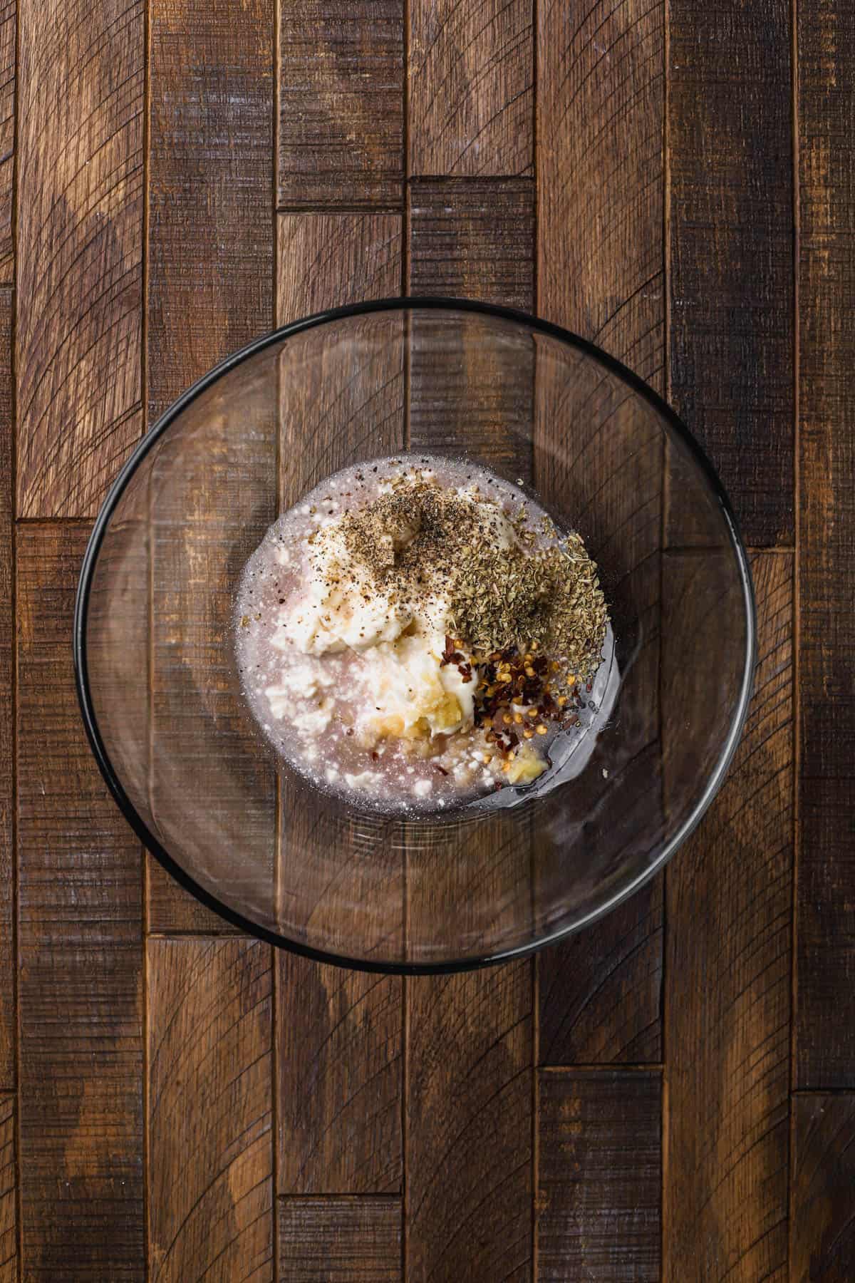 Mayo, garlic, oregano, chili flakes, and red wine vinegar.