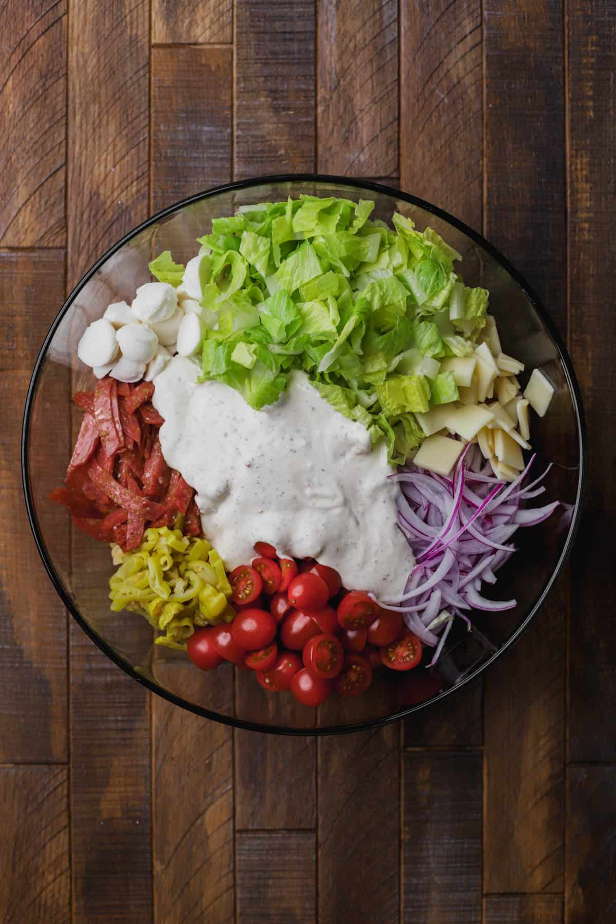 Rotini pasta, creamy dressing, tomatoes, provolone, mozzarella, peperoncini, salami, romaine lettuce and pepperoni.