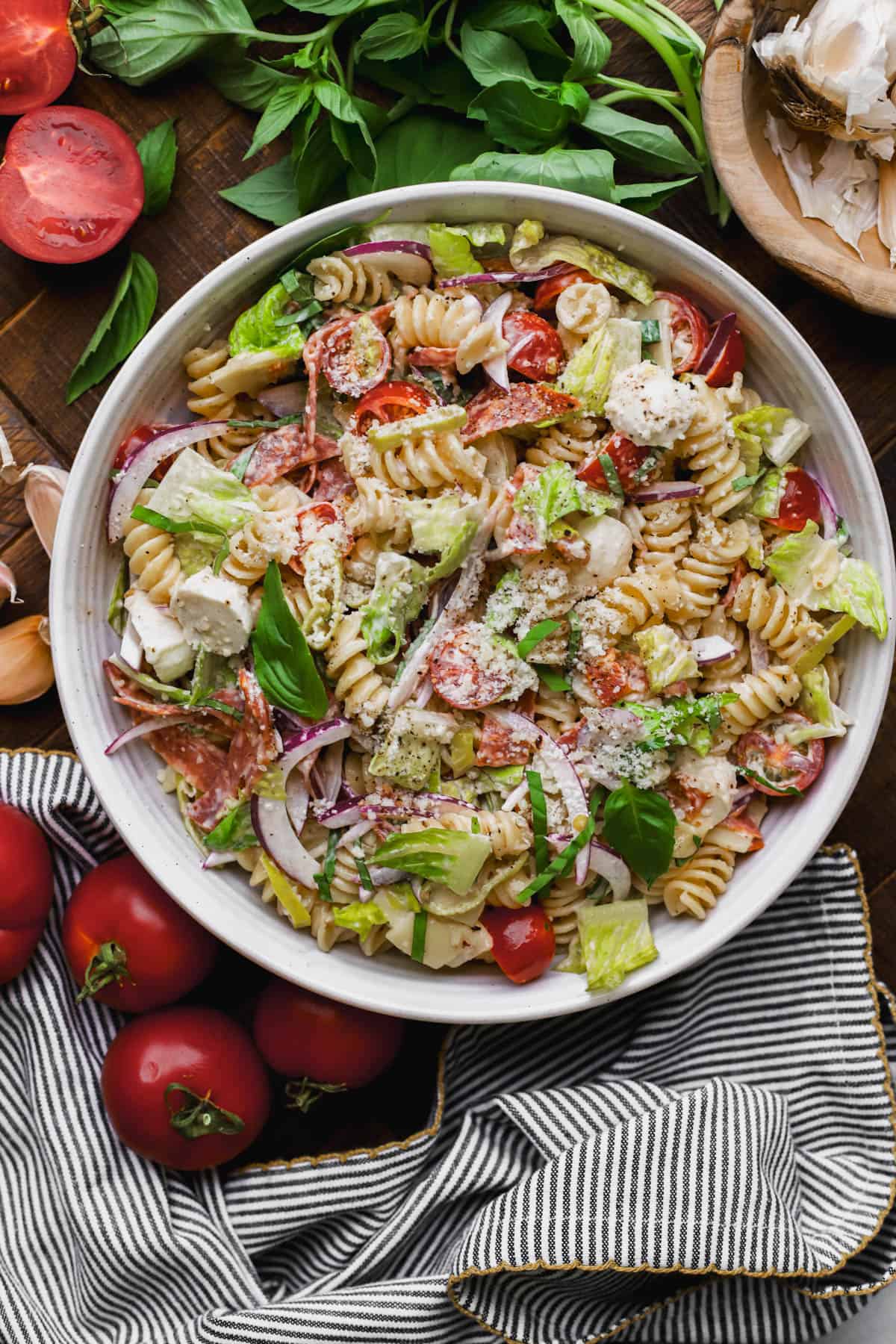 Grinder pasta salad with creamy Italian dressing, cured meats, mozzarella, provolone, romaine lettuce, parmesan, tomatoes and red onions.