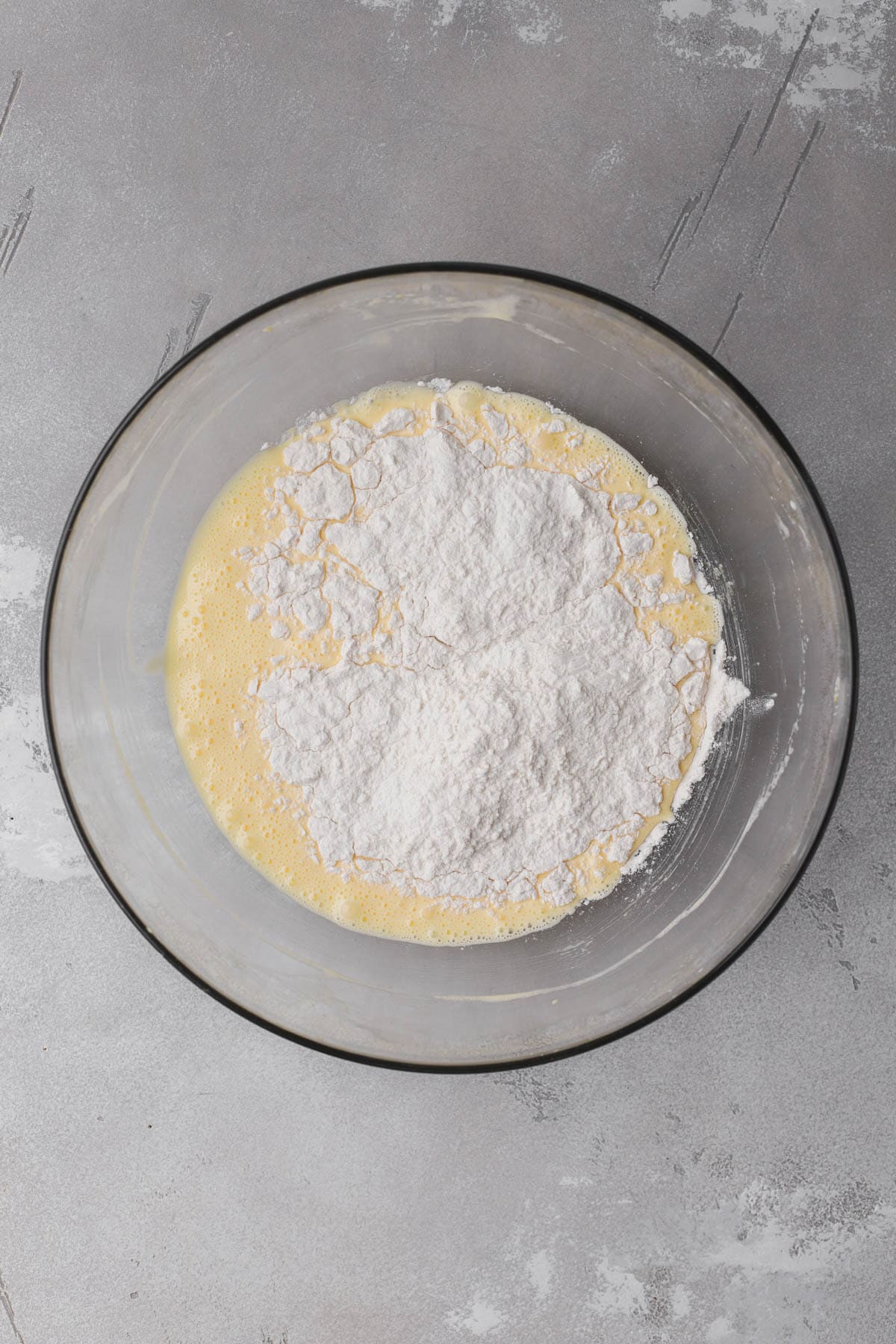 Whipped egg yolks, sugar, flour, vanilla, milk, baking powder and salt.