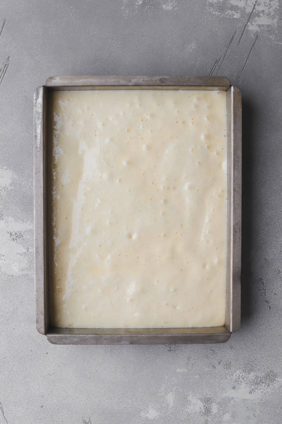 Cake batter poured into 9x13 cake pan.