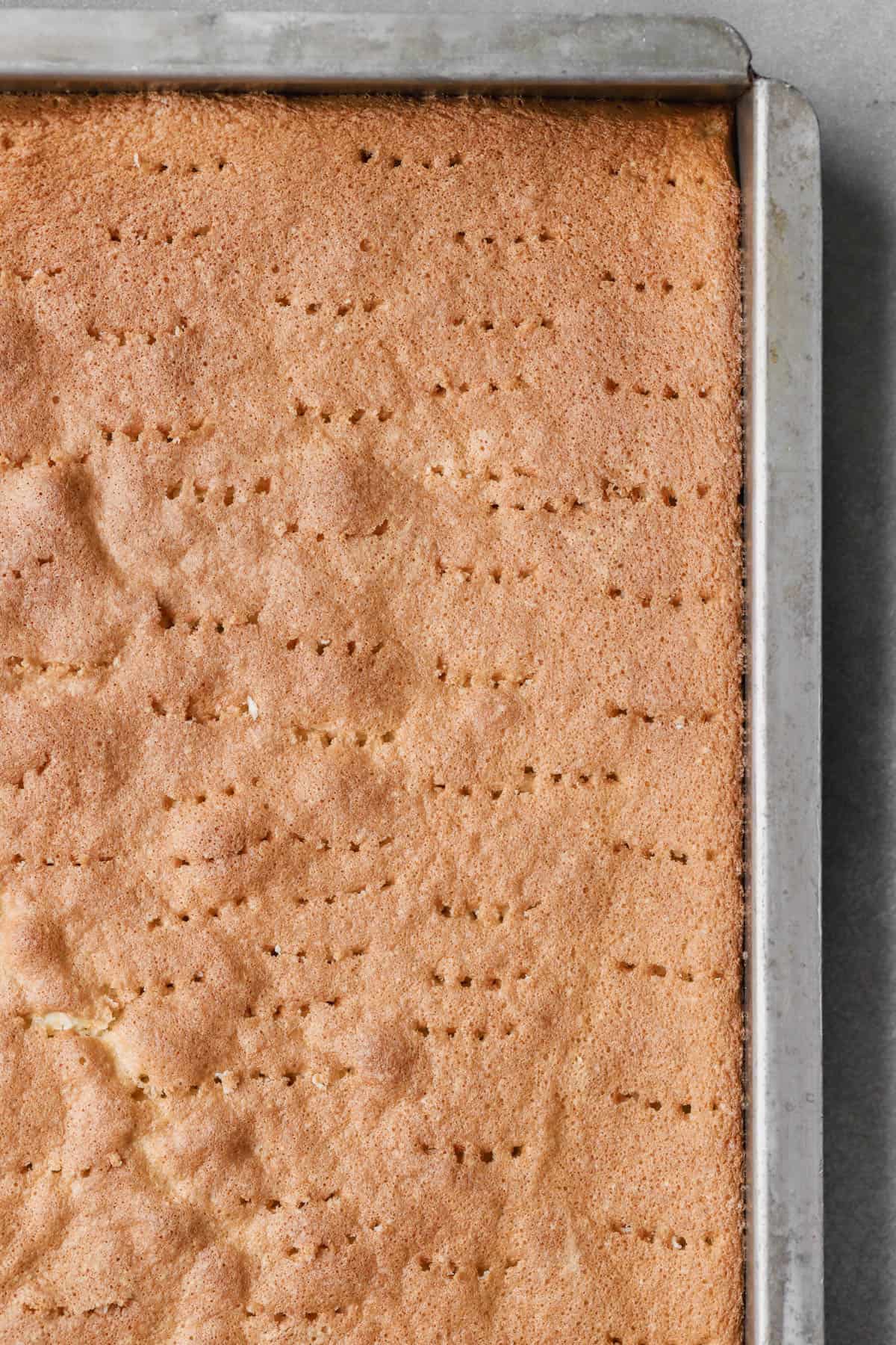 Sponge cake poked with hole.