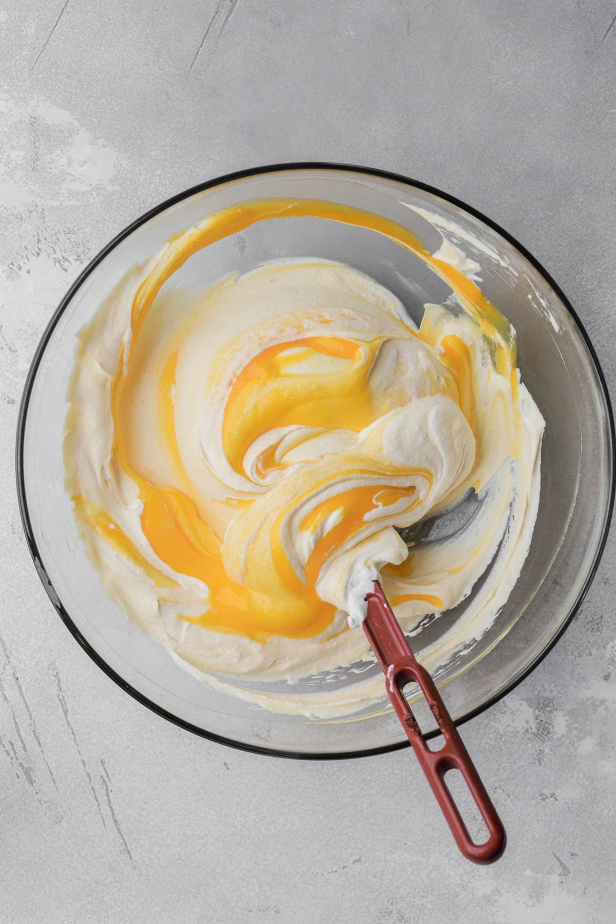 Whipped cream with mango puree.