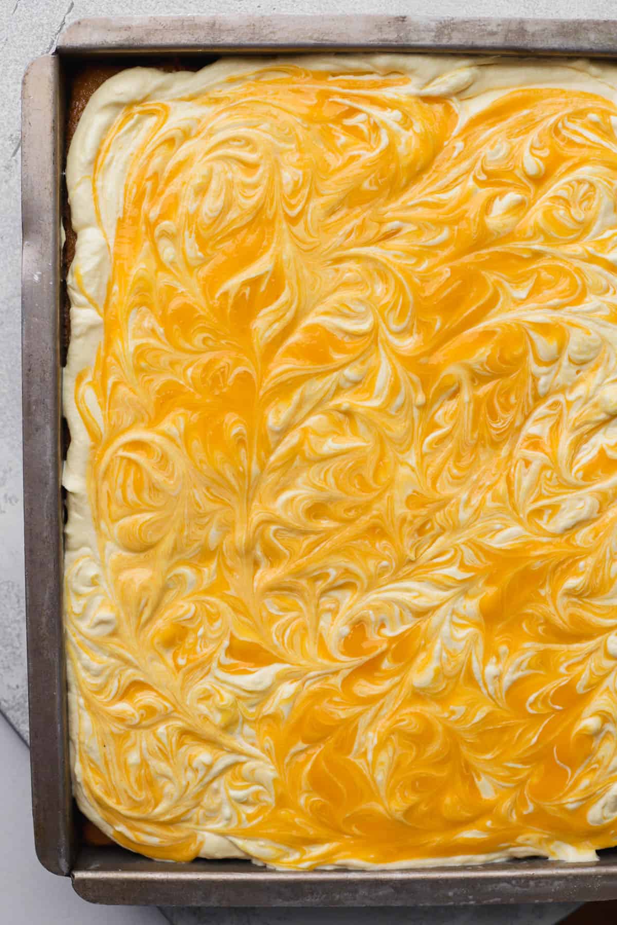 Mango whipped cream topped with more mango puree.