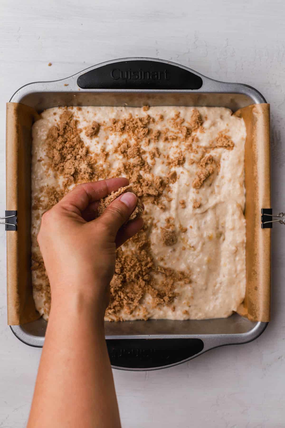 Banana bread batter topped with cinnamon streusel. 