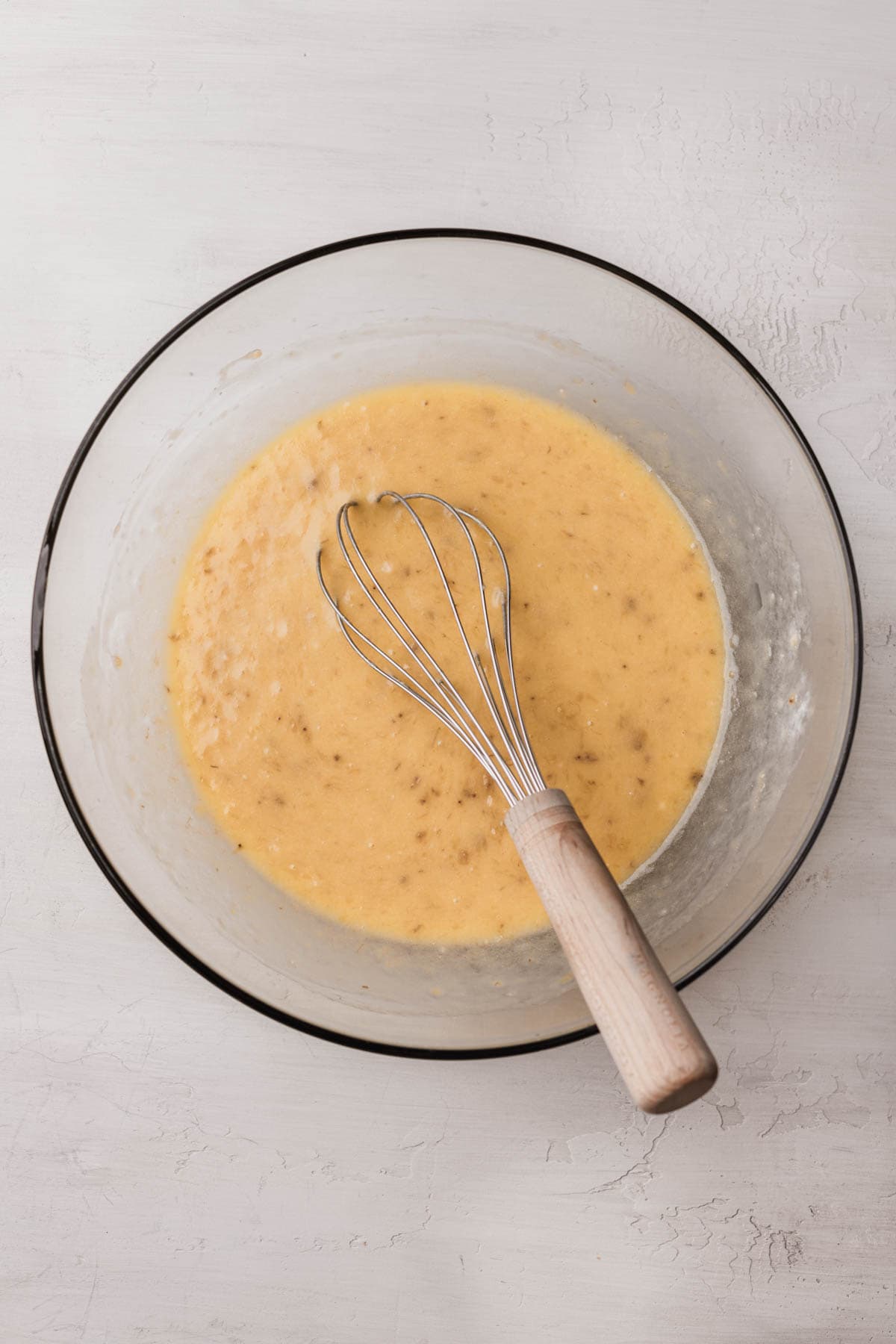 Eggs, melted butter, sugar, sour cream, vanilla and mashed bananas. 