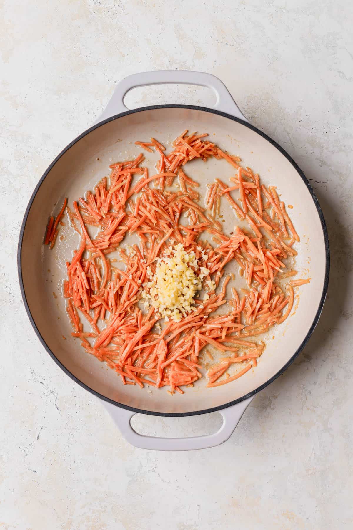 Butter, julienned carrots and garlic. 