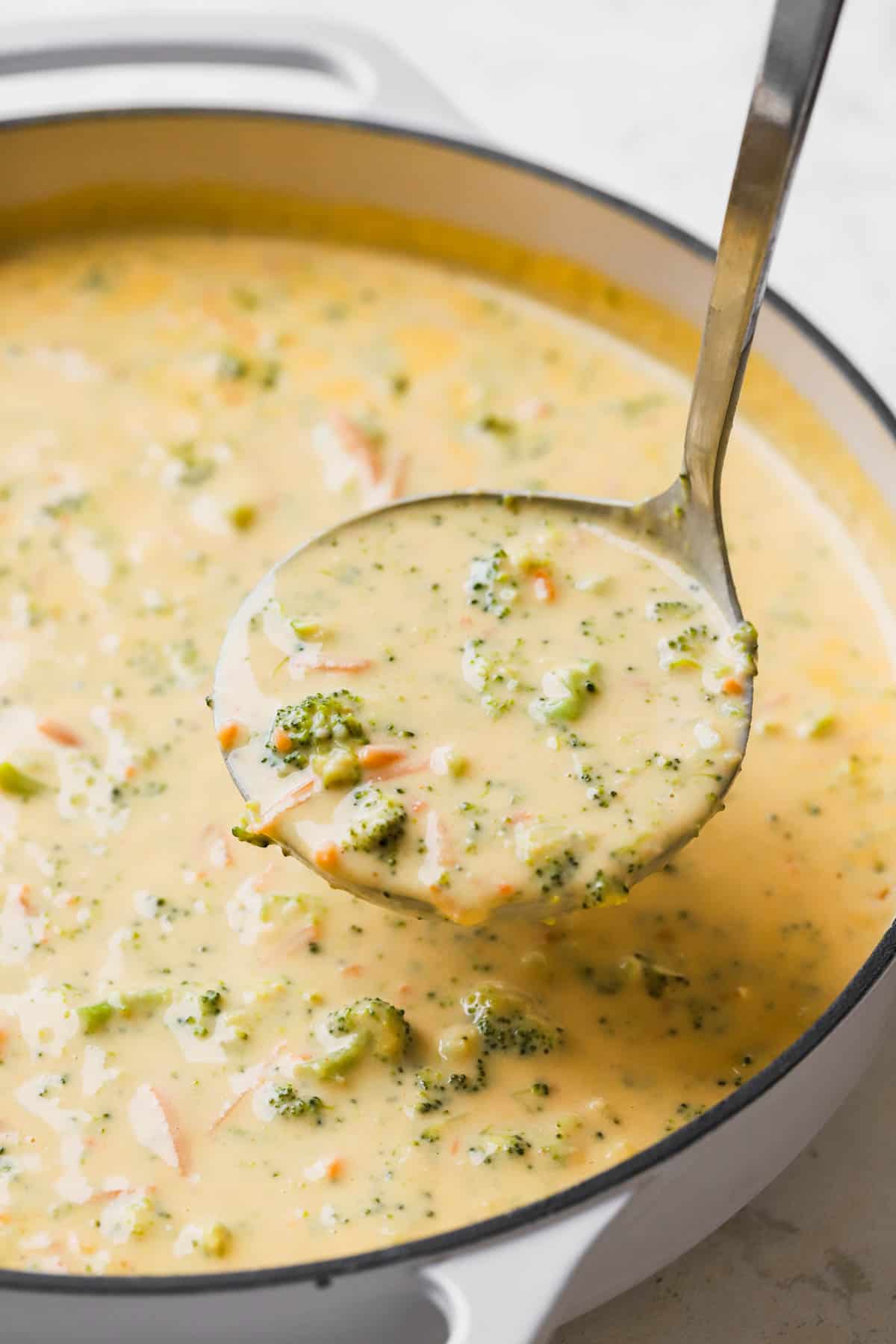 Gluten free broccoli cheddar soup with cheddar, cream cheese, garlic, carrots, chicken stock and milk. 