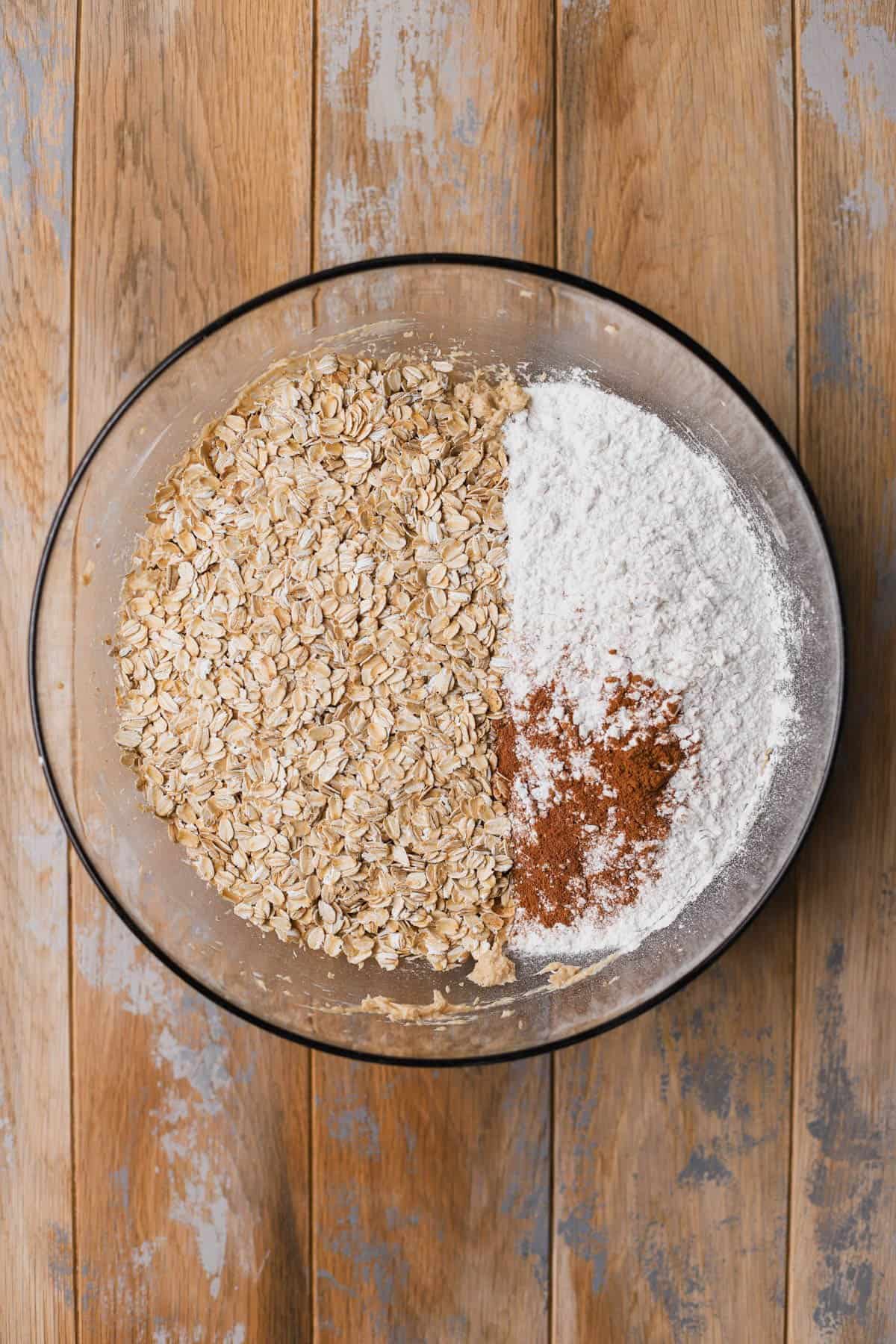 Creamed butter mixture with flour, baking soda, salt, cinnamon and rolled oats. 