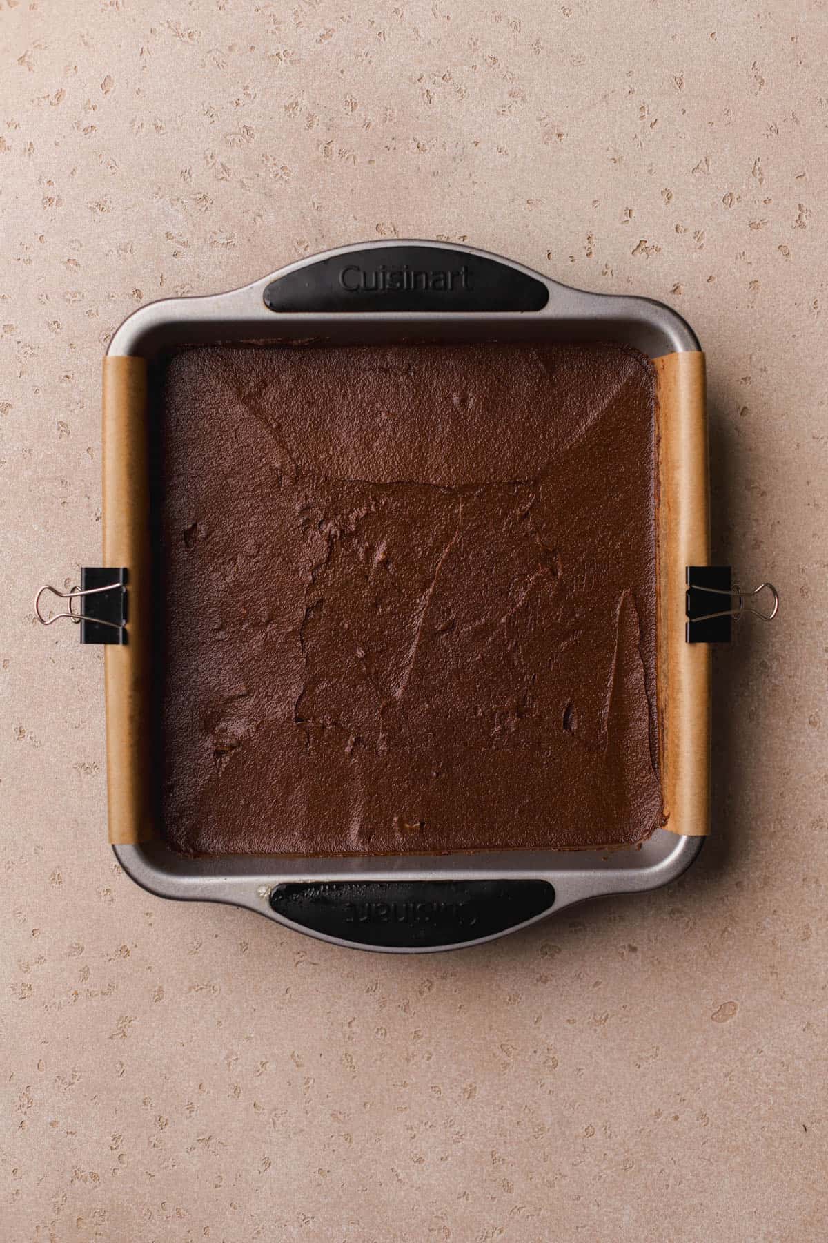 Brownie batter spread into 8x8-inch baking pan. 