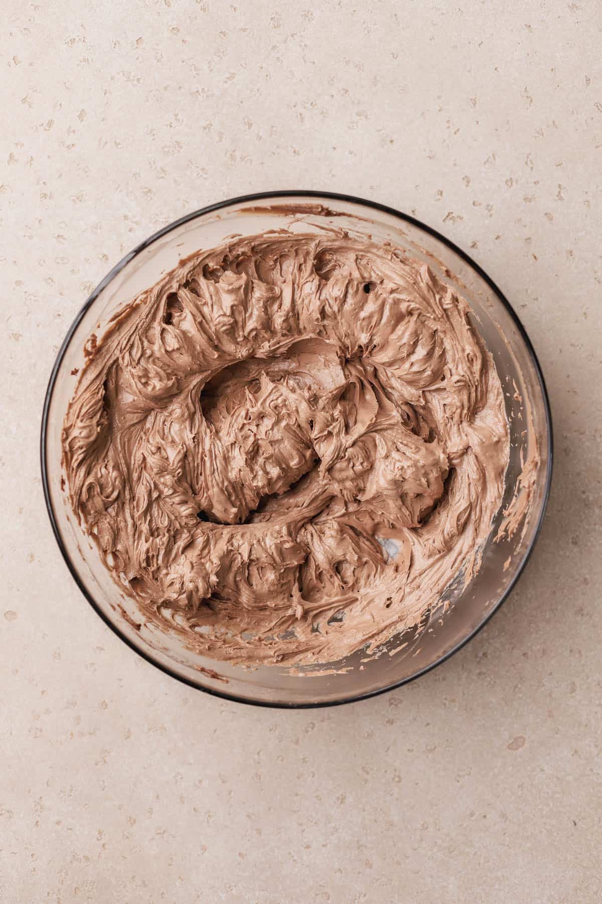 Whipped cream cheese, sugar, vanilla, and cocoa powder. 