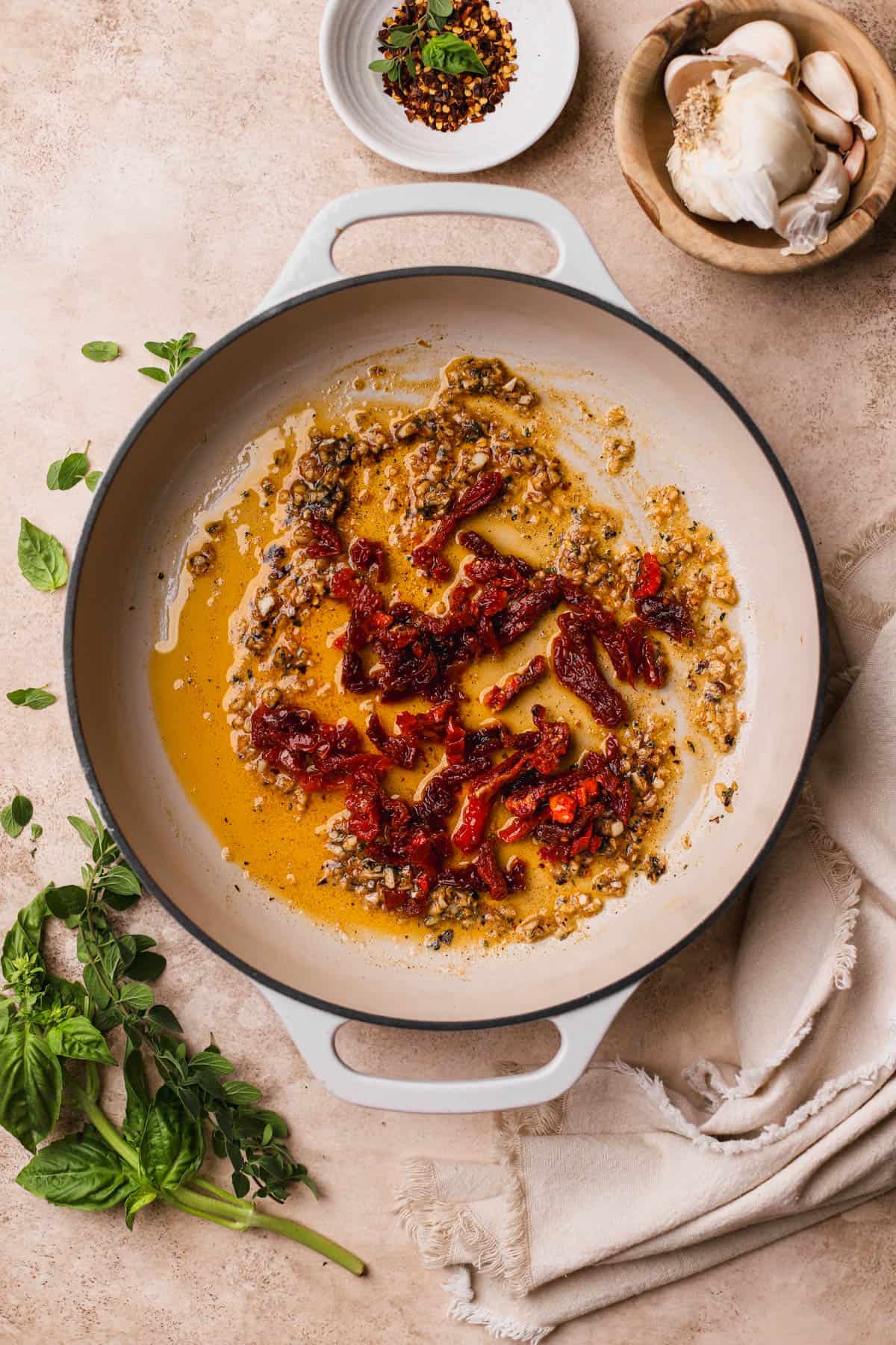 Sauteed garlic, red pepper flakes, smoked paprika, oregano, and sun-dried tomatoes.