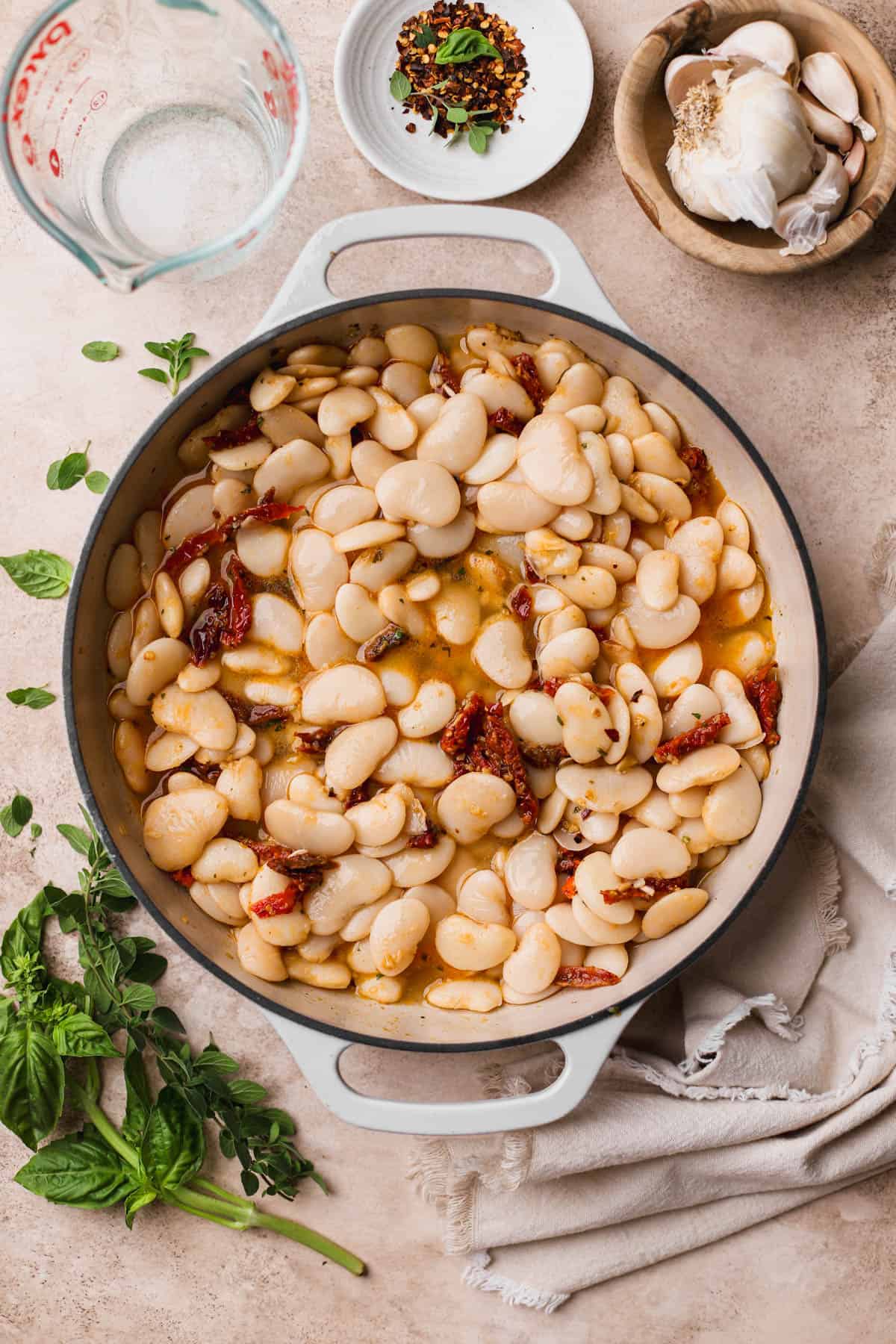 Sauteed garlic, red pepper flakes, smoked paprika, sun-dried tomatoes, and chicken stock.