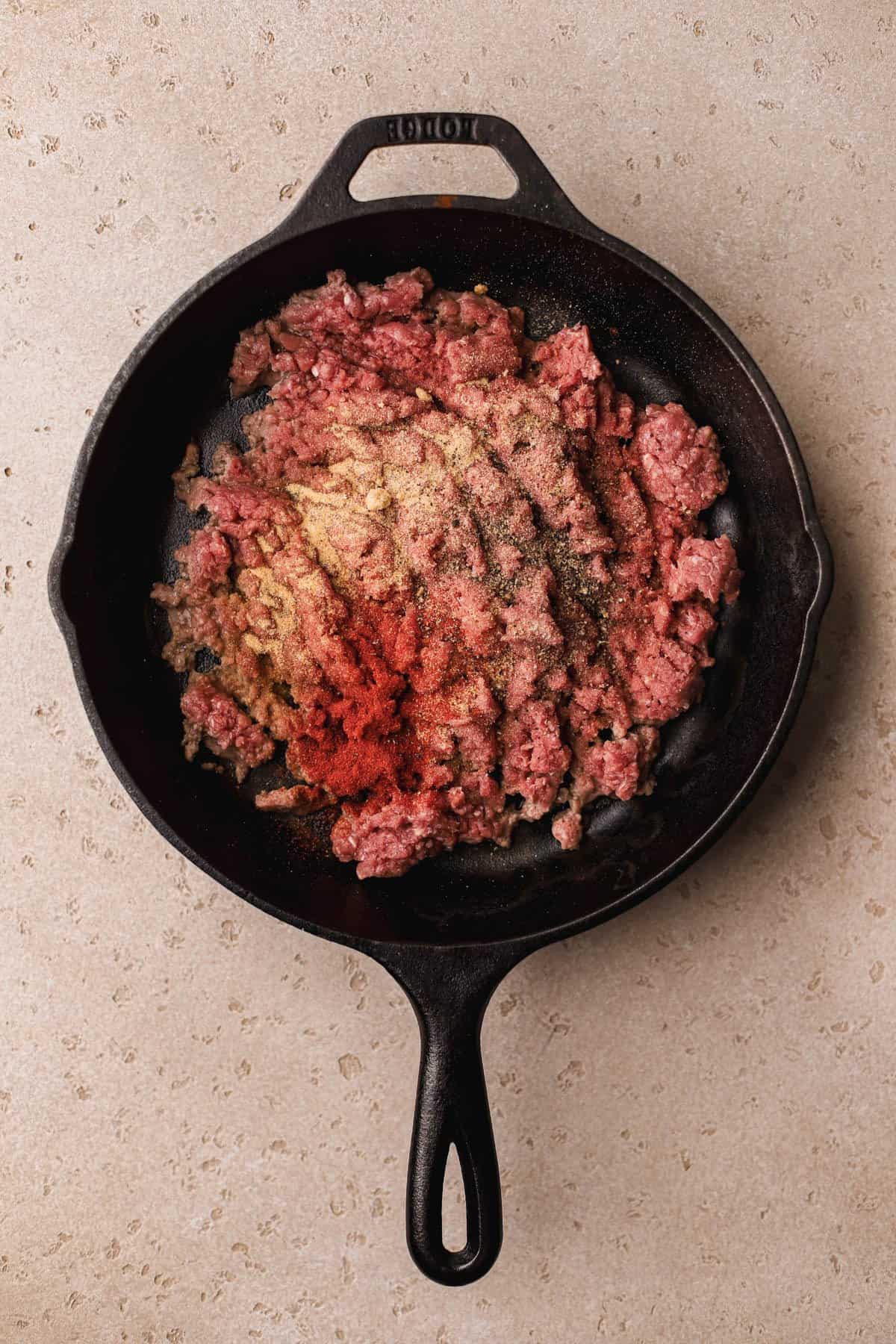 Ground beef, onion powder, garlic powder, salt, pepper, and paprika.