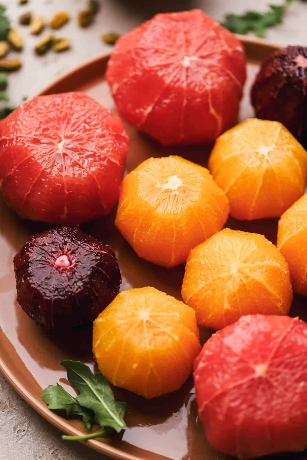 Peeled grapefruit, navel oranges, and blood oranges.  