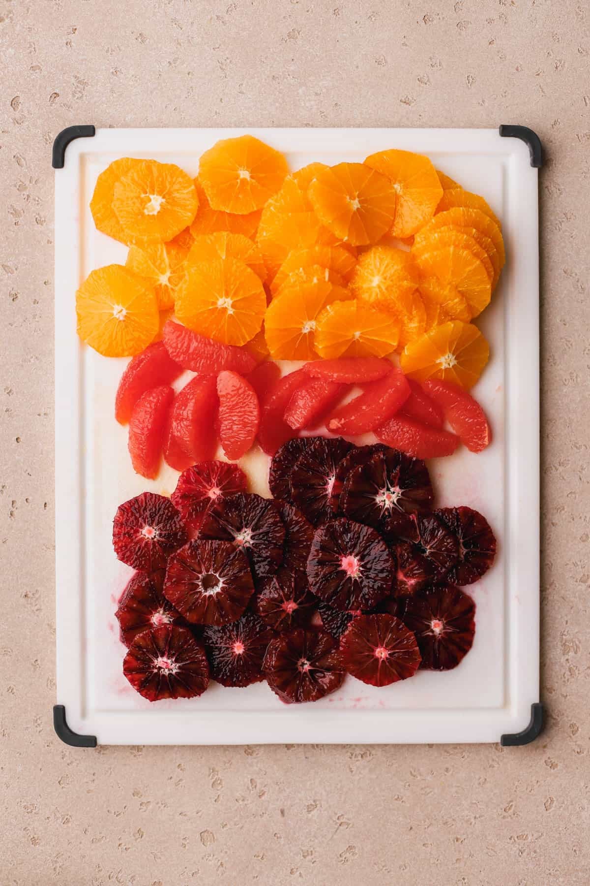 Sliced grapefruit, navel oranges, and blood oranges.  