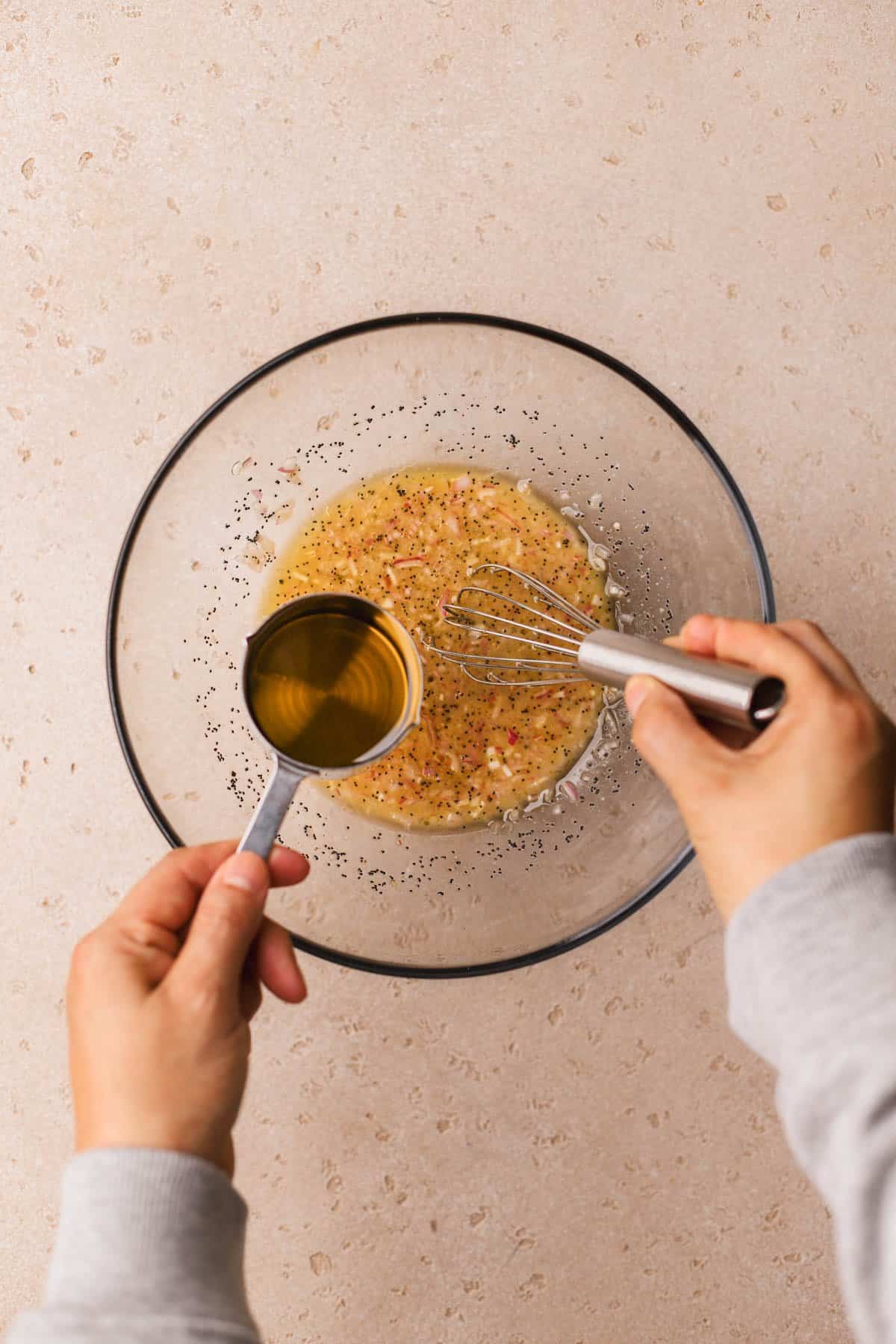 Honey, apple cider vinegar, garlic, poppyseeds, dijon, shallots, olive oil, salt and pepper. 