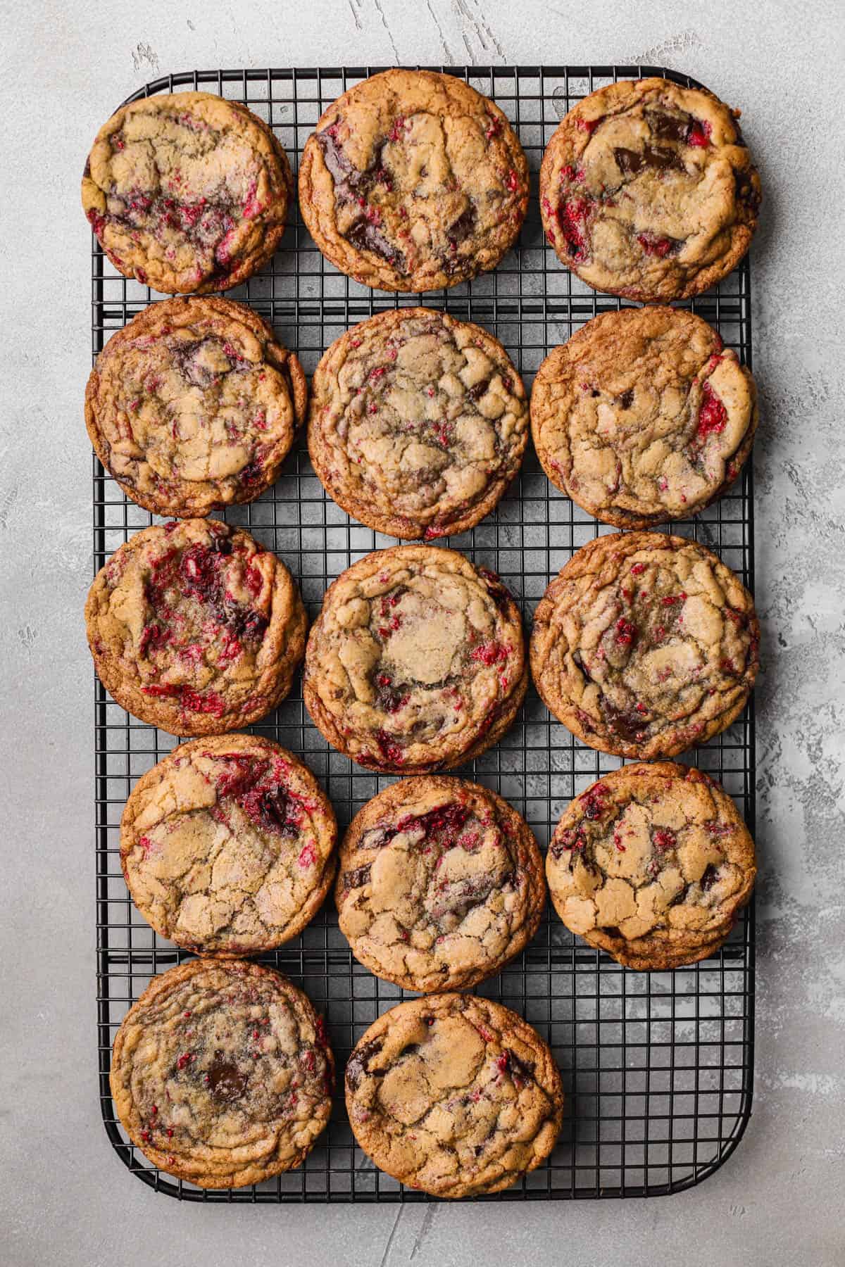 Raspberry chocolate chip cookies with frozen raspberries and dark chocolate chunks. 