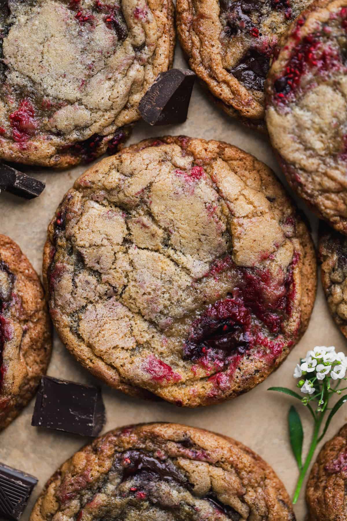 Raspberry chocolate chip cookies with frozen raspberries and dark chocolate chunks. 
