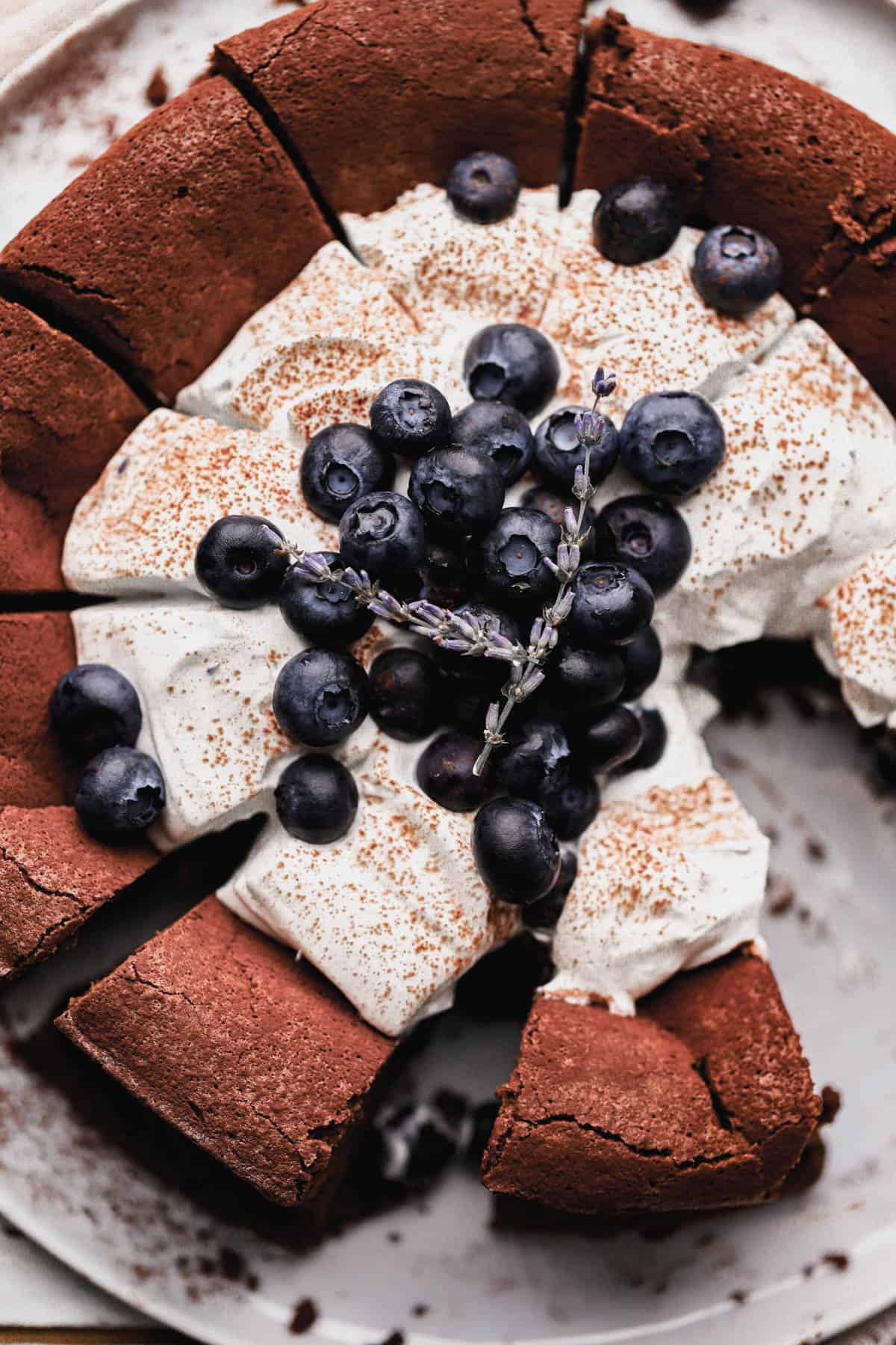 Flourless chocolate blueberry cake with homemade lavender infused whipped cream and fresh blueberries. 
