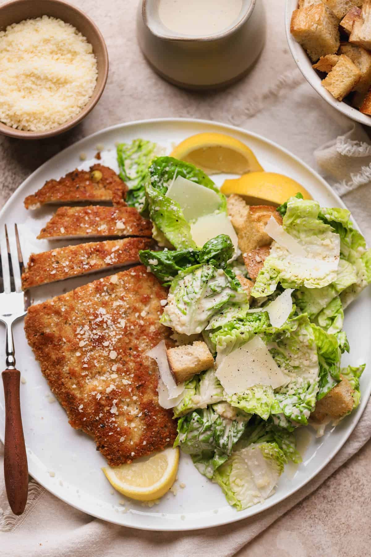 Crispy chicken caesar salad with parmesan crusted chicken, homemade dressing, sourdough croutons and shaved parmesan cheese.  