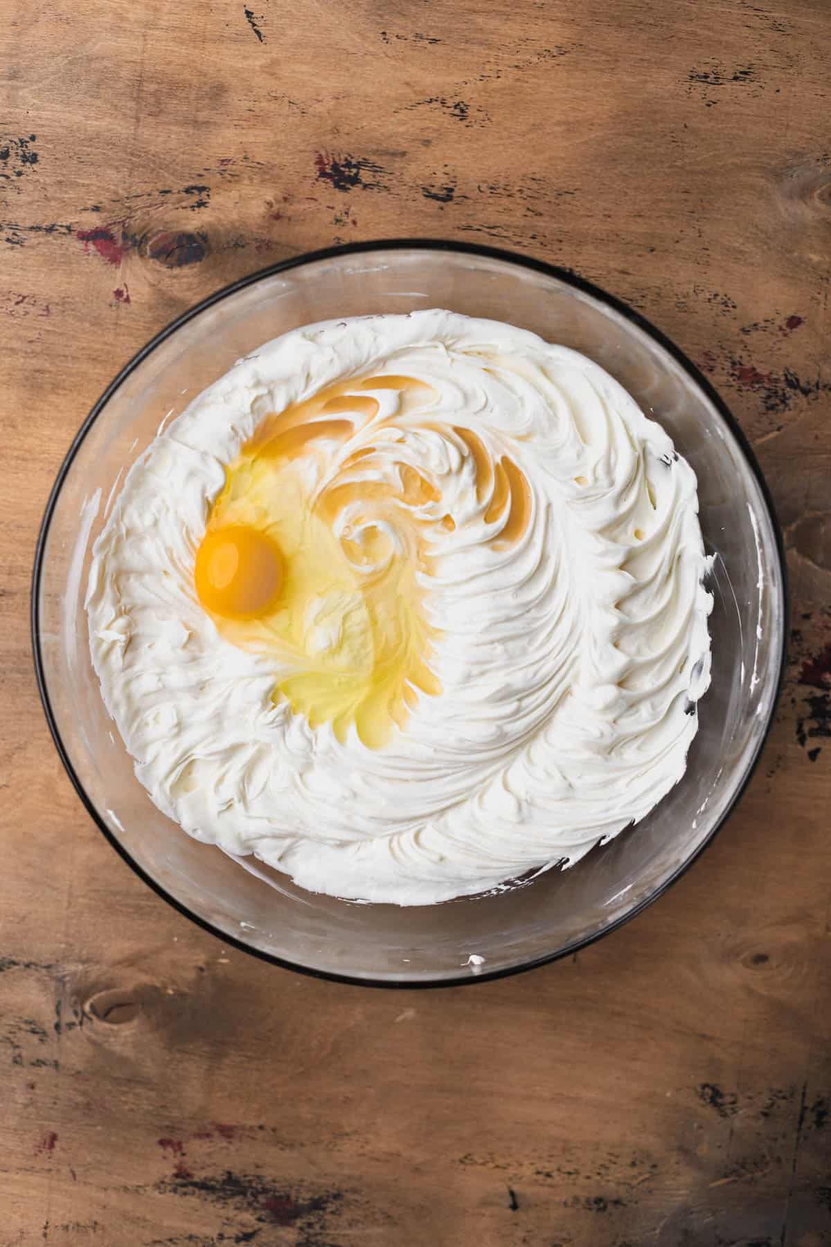 Whipped cream cheese, sugar, sour cream, eggs and vanilla.  