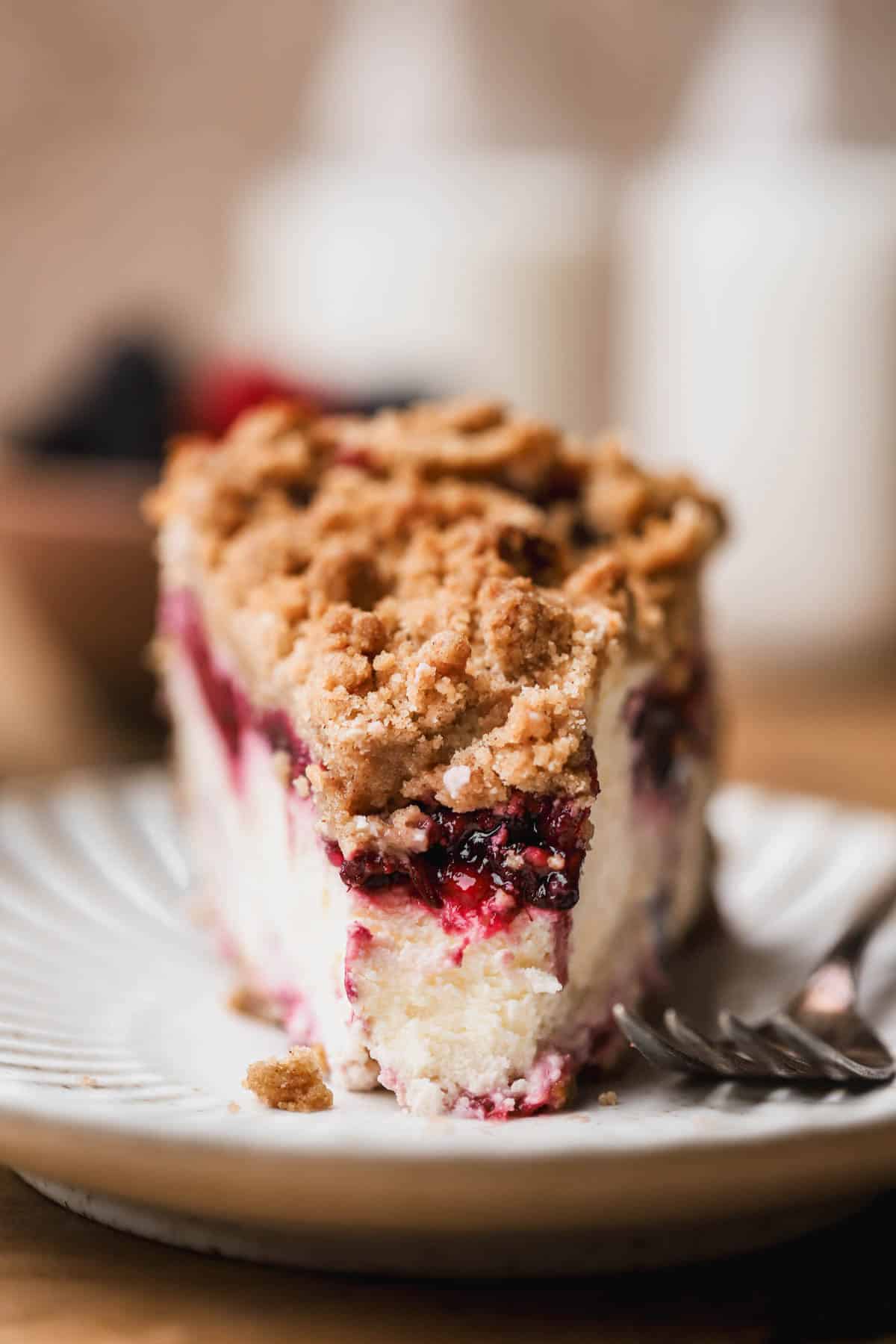 Berry crumble cheesecake with graham cracker crust, mixed berry compote and cinnamon crumble. 