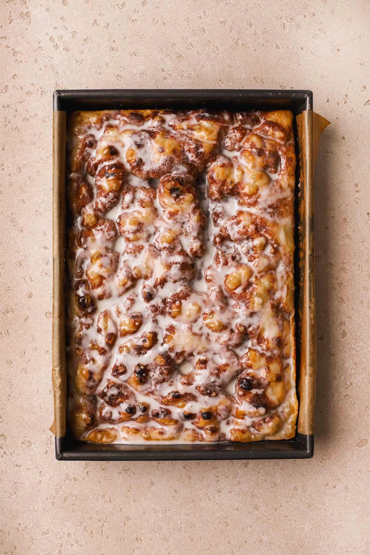 Cinnamon focaccia drizzled with vanilla glaze.